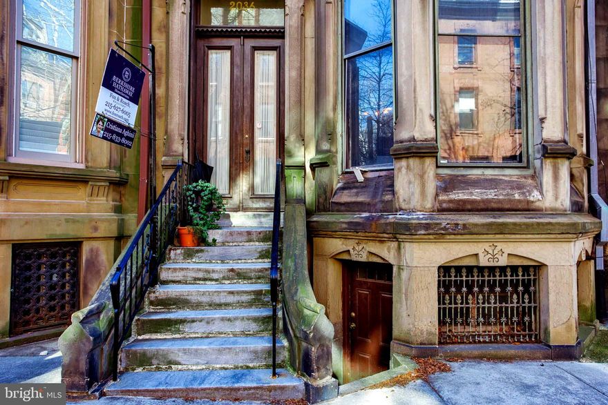 Just off Rittenhouse Square, this elegant historic townhome is one of the last originals that has remained as a private residence since it was built in 1800s. The property  -  over 4,300 sq feet on four full stores, occupies a  large lot of 20 x 120 feet between Spruce and Cypress St. It has preserved most of the original features as grand mahogany staircase, original Victorian wooden doors, stained glass windows, unique hard wood floors,  four fireplaces with marble mantels, antique wall scones and mirrors, window seats, etc. The 14 ft high ceiling First floor features a beautiful vestibule with antique chandelier and mirror, two entrances to the  elegant Livingroom that displays a beautiful  fireplace and large three bay  windows. The stunning dining room facing the spacious back yard features stained glass windows, a sculpted marble fireplace,  wall sconces and tall mahogany panels. The entrance doors to the vestibule and to the dining room are decorated with Tiffany glass.  A kitchen and a small bathroom have been added to the first floor between the Livingroom and the dining room for the owners' convenience. The second floor contains the master suite  which includes a great Family Livingroom, two large bedrooms, dressing room with ample closets and a full bathroom.
The third floor features one Livingroom, two large bedrooms, full bathroom and kitchen. The forth floor has two bedrooms, bathroom and kitchenette plus a large atrium - perfect for an Artist studio.
The lower level of the house hosts a large room that has four windows and an exit to the backyard which offers space for two car PARKING. This is  the former original kitchen of the house appointed  with a London custom made wood burning  stove. Also at the lower level there are the  
laundry room, two large storage rooms and a spacious room with windows and exit to Spruce St.
There is a second basement in the building hosting the utilities. The home is located on a beautiful tree lined block, close to Rittenhouse Square, Fitler Square, Schuylkill River bike trail and dog park.  
The proximity to the Arts and Entertainment that City has to offer as well as to the main transportation means, adds value to this unique property - a must see.