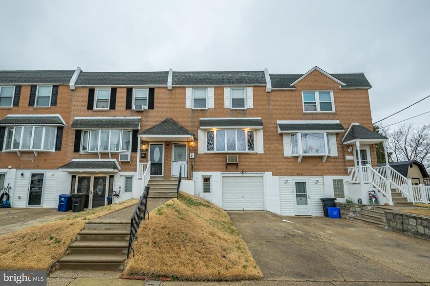 Welcome home to this 3 bedroom rowhome located in the Morrell Park community of NE Philadelphia. Offering versatile living space and hardwood flooring throughout, this home blends comfort, charm, and functionality. Step inside to your bright and spacious living room, anchored by a large bay window that fills the space with radiant sunshine. The living room flows seamlessly into your dining room, complete with a chandelier—perfect for gatherings and everyday meals. Take a few steps further to your eat-in kitchen, featuring a tile backsplash, ample cabinetry, and generous counter space. A separate dining area highlighted by a chandelier provides additional space for casual meals, while sliding doors lead to your upper backyard deck, creating the ideal setup for indoor-outdoor entertaining. A convenient coat closet and powder room complete this level. Upstairs, you’ll find three spacious bedrooms, each with ceiling fans and ample windows for natural light. The primary bedroom suite offers dual closets and a private ensuite powder room. A full hallway bathroom and linen closet complete the upper level. This home features a full walkout lower level basement with a dedicated laundry room and a bonus living area that can easily serve as a family room or playroom, with direct access to the backyard. This level also provides direct entry to the attached garage. Step outside to your fully fenced backyard, offering plenty of space for entertaining or relaxing and enjoy your morning coffee or evening unwind on the upper deck. This home offers an attached one-car garage with bonus workspace and driveway for ample parking! Other recent upgrades include NEW roof, NEW furnace and NEW water heater!  Ideally located close to a variety of restaurants and shopping yet near both the Cornwells Heights and Torresdale Station with direct service to Center City, Route 1, I-95 and the PA Turnpike for easy commuting! Don’t miss your opportunity to see this beautiful home today!