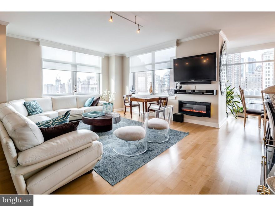 Custom condo steps from the Kimmel Center.  Pet friendly on the Avenue of the Arts with Suzanne Roberts Theater and 2 restaurants.  24 Hour concierge and security, spa with sauna, seam, massage room, fitness center, wine cellar and magnificent pool area.   Corner 3 bedroom unit with 2 car indoor parking.  Floor to ceiling windows with panoramic sunset views.  Designer upgrades include crown molding and wooden valances, custom cabinetry, flooring, bathrooms, soaking tub.  Kitchen with stainless appliances, granite counters, designer back splash.  Marble master bath with double sinks, center bath with 2 person whirlpool, extra custom closets added and fitted, the epitome of luxury living.  Remaining tax abatement.  Owners are licensed PA real estate agent and broker.  Garage spaces 552 & 553 and Storage locker 127 included. Weight limit for dogs is 25 pounds.