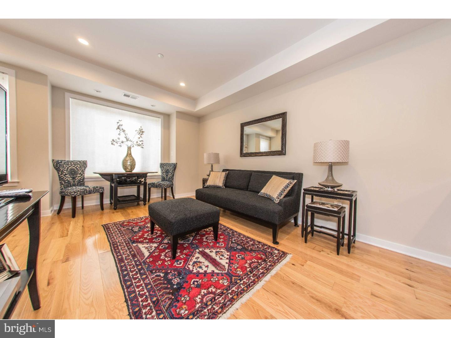 Fantastic opportunity to own a pristine, 1-bedroom boutique condo in popular Graduate Hospital. With a private deck, tax abatement and low condo fees, this condo is a short walk directly north to Rittenhouse Square and is close to booming Point Breeze to the south. Enter the building via video intercom with buzzer and up the common stairway to the 2nd level. The spacious living room has recessed lighting, 4 bright windows, a dining alcove and custom window treatments. The beautiful chef's kitchen has white quartz counters with a peninsula and convenient stool seating. There's also soft-close cabinets & drawers, a glass tile backsplash, stainless steel appliances, wine fridge and pendant lighting. Proceed towards the back of the property to find the huge hall bathroom with extra wide vanity and glass tile backsplash. The double-wide stall shower has custom glass doors and matching glass tile accents. In the hallway there's an additional storage/linen closet and convenient laundry closet with stackable washer & dryer. The large rear bedroom has a ceiling fan and double set of closets that runs the entire length of the room. Sliding doors lead to the coveted, private rear deck. Your own personal outdoor sanctuary to enjoy a morning cup of coffee or evening glass of wine. Tremendous value and wonderful opportunity to buy an affordable, newer construction (2014) property with tax abatement in one of Philly's hottest neighborhoods. Central air, hardwood floors throughout, low condo fees and quality construction make owning this unit cheaper than renting. Ideal for 1st-timers, pied-a-terre or to purchase for grad students or medical residents. Short walk to Rittenhouse Square, Sidecar, Ultimo, UPenn, CHOP & City Hall west. Shows impeccably, won't last long, schedule your showing today!
