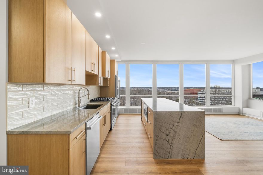 Perched on the top floor of Sutton Terrace, this rare corner residence offers 1,303 square feet of completely renovated luxury with commanding, unobstructed views of the Main Line and the Center City skyline.

Every inch of this condo has been reimagined with an open-concept layout designed for modern life. The centerpiece is the chef’s kitchen, featuring custom rift-cut white oak cabinetry and a dramatic Ocean Blue waterfall quartzite island that serves as a work of art. The living space is grounded by premium COREtec Luxury Vinyl Plank (LVP) flooring and framed by expansive, wall-to-wall windows that flood the unit with natural light.

The floor plan includes a spacious bedroom, a distinct home office, and 1.5 exquisitely finished baths. The primary suite features two massive walk-in closets and a master bathroom with a rainfall shower and floating double vanity. Additional conveniences include modern keyless entry, a private balcony for outdoor enjoyment, a dedicated laundry room (with washer and dryer), pantry + coffee stand, modern lighting, and ample storage throughout.

Life at Sutton Terrace offers the perfect blend of Main Line prestige and Center City convenience. Residents enjoy full-service living with a 24-hour doorman/concierge, ensuring security and ease for all deliveries and guests. The building features resort-style amenities including an outdoor pool with cabanas, tennis and pickleball courts, a fully equipped fitness center, EV charging stations, and a social room/library.

The new owner can rent a spot in the indoor garage for $140.00/month which includes weekly car washes.