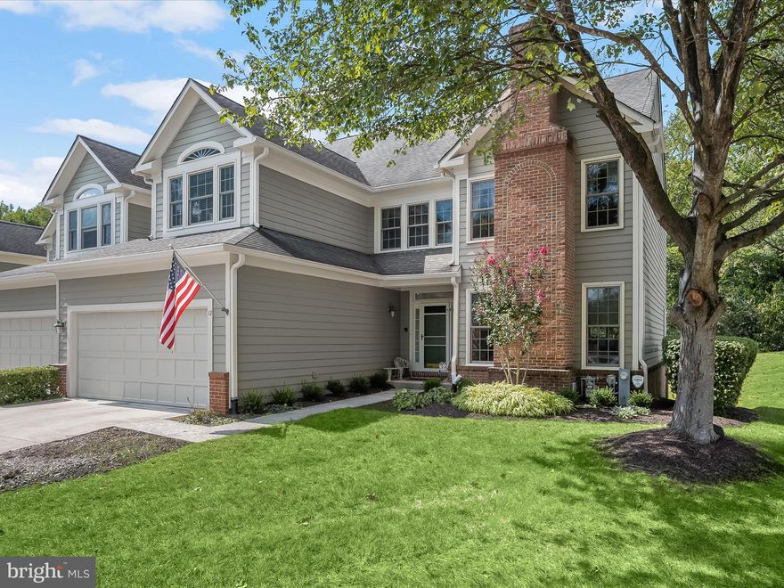 Welcome to 12 Old Granary Court, a stunning end-of-group townhome nestled in the sought-after Foxhall Farm community of Catonsville, backing to the serene Patapsco State Park! This light-filled home features beautiful hardwood floors and a thoughtfully designed layout. Step inside to a dramatic two-story foyer leading to a spacious living room adorned with a cozy fireplace and elegant crown molding. The formal dining room impresses with soaring 20-foot ceilings, classic moldings, and a charming China closet. The eat-in kitchen is a chef’s delight, boasting granite countertops, decorative tile backsplash, a pantry, and a sunny casual dining area framed by a bay window. The adjacent family room offers a stacked stone gas fireplace and access to the deck perfect for indoor-outdoor entertaining. A powder room, laundry room, and an attached two-car garage with epoxy flooring complete the main level. Upstairs, the luxurious primary suite showcases cathedral ceilings, dual walk-in closets, and a spa-inspired bath with vaulted ceilings and a skylight. Two additional bedrooms, a spacious walk-in closet, and a full hall bath provide comfort for family or guests. The finished lower level offers an expansive recreation room with walkout access to the patio, and a versatile space that could be used as an office, bonus room, or exercise room, along with a workshop area, and abundant storage. HOA fee covers exterior painting, roof replacement, gutter/downspouts replacement & cleaning, concrete walkway & driveway replacement, snow removal & lawn maintenance.  Recent improvements include Anderson Windows throughout! Community Amenities: Enjoy being in close proximity to locally owned shops and restaurants, Farmers' Markets, 4th of July festivities, free music venues, green space, the annual Arts & Crafts Festival, UMBC, CCBC, as well as a vast variety of dining, shopping, and entertainment options in nearby Historic Catonsville, Old Ellicott City, Downtown Baltimore, and more. Outdoor recreation awaits you at Patapsco State Park trails, Rolling Road Golf Club, The Catonsville YMCA and Trolley Trail. Convenient commuter routes include I-95, I-695, I-70, I-195, MARC Train, CCBC, and BWI Airport!