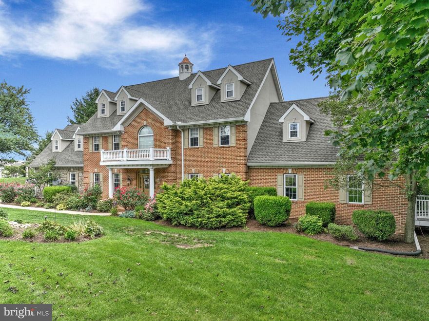 Exceptional 2½-story home offering 8,589 total square feet in the Donegal School District, featuring 6 bedrooms, 4 full baths, and 2 powder rooms. Designed for both everyday luxury and unforgettable entertaining, this remarkable property showcases exceptional indoor and outdoor living spaces throughout.
The meticulously renovated kitchen is filled with natural light from an abundance of windows and features a stunning 13-foot island topped with exquisite granite imported from India, two sinks, generous cabinetry, a large walk-in pantry, and first-floor laundry. Just beyond, the home’s showstopping 48’ x 13’ covered porch becomes a true extension of the living space—overlooking the expansive patio, view of pond with fountain, and breathtaking resort-style outdoor entertaining area.
At the heart of the outdoor experience is the impressive 38,000-gallon concrete/Gunite pool, privately tucked within a completely enclosed courtyard. Thoughtfully designed in connection with the entire lower-level entertaining area, this resort-inspired setting offers the perfect atmosphere for hosting large gatherings or enjoying peaceful relaxation in total privacy.
The main level also includes a formal dining room, family room with fireplace and custom trimwork, den, and an additional flexible first-floor room ideal as an office or bedroom, complete with a private staircase leading to additional flex space above. The second floor offers 4 bedrooms, including a luxurious primary suite featuring a fireplace, study/sitting area, and large custom walk-in closets. The third floor adds 2 additional bedrooms and a full bath.
The full daylight walkout lower level was designed for entertaining on a grand scale, complete with a second kitchen, spacious dining area, and game room—ideal for hosting family, friends, business associates, or even potential bed-and-breakfast use.
Additional amenities include an attached 2-car garage, detached carriage-style 3-car garage, below-grade 1-car garage, garden area, greenhouse, and equipment shed. The 1.7-acre property also includes a charming second home built in 1858, offering approximately 1,550 square feet with 3 bedrooms and 1½ baths—ideal for a caretaker, guest accommodations, or as a tenant house generating approximately $2,000 per month in rental income.
A truly one-of-a-kind property offering luxury, privacy, and endless possibilities. Contact us today for your private tour.