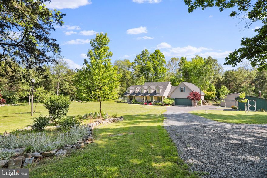 REDUCED $21,000 below appraised value!  Just take one step inside of this beautiful Cape Cod home, situated on 6.15 acres, and you will know you've found the one you've been looking for. The main living area boasts an open floor plan that features a large and sunny living room with cathedral wood ceilings that is sure to be the heart of the home. The living room flows seamlessly into the kitchen with attached dining area. Step through the sliding glass doors right off of the living room onto the large composite deck which will be the perfect spot to wind down after a long day or to entertain family and friends by the pool. The Master Bedroom Suite with attached bathroom and large walk-in closet is off to itself giving the owner plenty of privacy. Down the hallway from the main living room, you will find an in-law suite with 2 additional bedrooms, another full bathroom, living room and full kitchen. This suite even has it's own private front porch! Upstairs, there is another large bedroom that is in itself another primary bedroom with a full bathroom, living room and bedroom. This area could be easily divided into a two bedroom suite. But now lets take it outside...The first thing you'll notice is the huge fenced in rear yard! Lots of room out here to do whatever you'd like. If you're into gardening you'll even find a specific area that is even protected from the deer. Simply said, you will not have to leave home to go on vacation! There's even 4-Wheel/Horse trails throughout this property. You'll even get your own horse stable and fenced in paddock. Other community perks include: Enjoying the Opequon Creek for fishing, kayaking, canoeing or floating. Multiple outside buildings include a 24 x 31 detached garage/shop, 12 x 20 workshop with its own wood stove and a smaller shed. This home is also generator ready so you'll never be left in the dark (separate generator required). You'll find this lovely home in the gated Berkeley County subdivision  of Greystone on the Opequon which is conveniently located close to several commuter routes, schools, shopping and it's only 15 minutes to the Hospital. This is absolutely a home that you don't want to let pass you by. This home was just appraised and being offered at below market value.