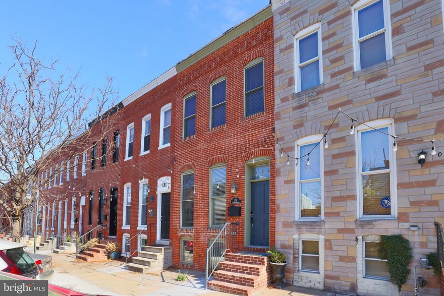 Chic and Charming! Welcome home to your 2 bedroom 2 full bath home with one car parking. Main floor open concept with gleaming hardwood floors and authentic brick accent walls. The living room has a cozy, decorative brick fireplace. The gourmet kitchen with granite counters has stainless appliances, tons of counter and cabinet space and bonus under cabinet lighting. Upper level offers 2 bedrooms and 1 full bath, hardwood floors throughout. The front primary bedroom has 3 large windows, brick accent wall, and a ceiling fan. The renovated hallway bathroom has a tile surround with in-laid glass accent tilework for the shower/tub combo. The rear bedroom has a ceiling fan and large walk-in closet. The lower level basement is perfect for recreation or a rental unit. This home has an awesome fenced patio and the spacious and easy to park 1 car parking.