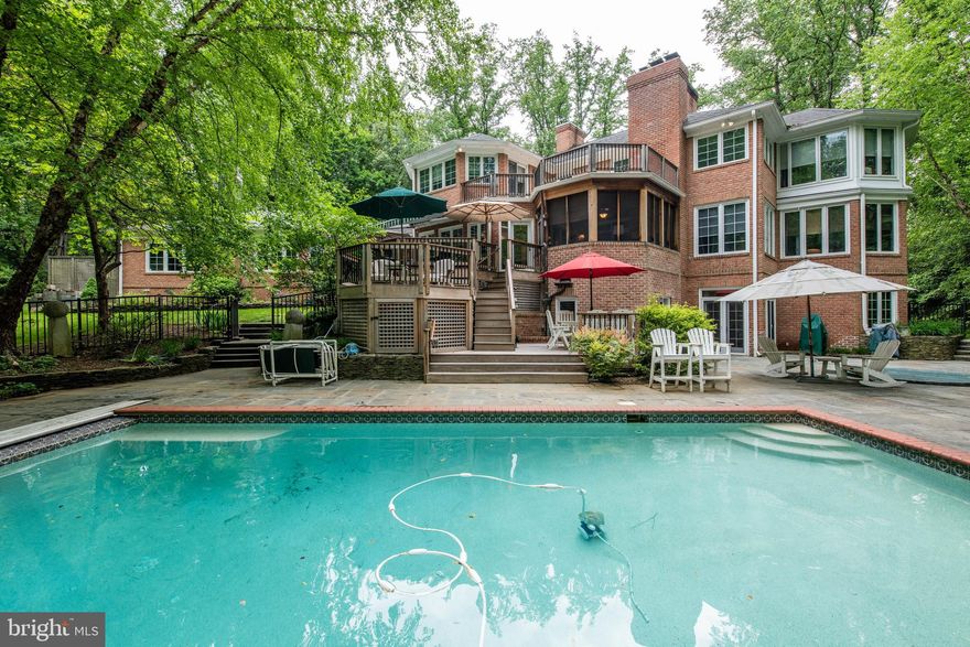 Relax and entertain indoors and out in the incredible living spaces of this sun-drenched all brick home. The lushly landscaped & wooded 1.26 acre property, with over 7100 square feet of finished living space, is located on a private cul-de-sac in the premier Annapolis area waterfront community of Poplar Point*Chef s kitchen with granite countertops & center island, two Fisher Paykel dishwashers, Wolf wall ovens & Wolf gas cooktop with Viking Hood, wine cooler, built-in 48  refrigerator*Hardwood floors throughout the home with Brazilian cherry inlay in the living room & dining room*Formal dining room with butler s pantry*Built-in speakers with individual room volume controls throughout the home   even in the garage! Elegant master bedroom with fireplace and sun room/sitting room, luxury bath*All bedrooms are spacious and have walk-in closets* Main level two room In-Law, Nanny or Au Pair suite*Immense lower level recreation room with high ceilings, projection tv/movie screen with surround sound (conveys), wet bar with mini fridge, exercise room, full bath, and wine cellar* Entertainment space galore-- Screened porch overlooking the heated pool with retractable cover, hot tub, slate patio, and multiple decks including roof-top sun deck*Poolside bath and pool equipment room*Ipe wood (Brazilian walnut) steps lead from the circular drive to the covered front porch*Deep water boat slip (with no bridges to the bay!) conveys - private marina with clubhouse & kayak/paddleboard storage*Striking brick wood-burning fireplace in the family room, two gas fireplaces plus wood stove on lower level, 3 car garage with 3rd bay oversized door to accommodate large SUV/boat/RV storage*Irrigation system*Generator plug and bypass panel*Pages of upgrades & special features in this luxurious 6 bedroom, 6   bath home   Ask your agent for a copy! Community dinner group, bridge club, frequent community association and marina association get togethers*Just minutes to Annapolis, Ft. Meade, DC, and Baltimore! Make sure to watch the video tour.