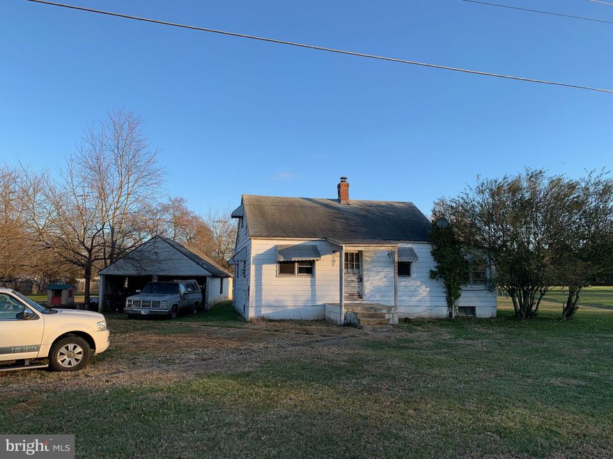 Successful buyer will have sales price at least $25K over list price. No opportunity near this price and location in PW County.  Required addendum is online.  Current house may be non-conforming zoning use. Obligation to obtain zoning approval for intended future commercial, industrial or residential use is with buyers.  0.43 acre lot has private septic and public water and is zoned A-1 in Regional Employment Center planning area. Completely as is. Everything you see is what you get except motor vehicles may be removed! Personal property left on site at closing conveys at no liability to seller and no cost to buyer. Little 1954 616 sq ft house has 2 bedrooms and 1 bath and enclosed sunroom/porch.  Stairs from porch floor hatch down to 4-5' concrete floored crawl space with good cinder block walls, 2 windows, and 2 sump pumps. "No home sale contract" means contract cannot be contingent on sale or lease of another property." Multiple cash offers in hand well over list price. Deadline for best and final is 12/22 12:00pm EDT. Closing date 1/16/2020.