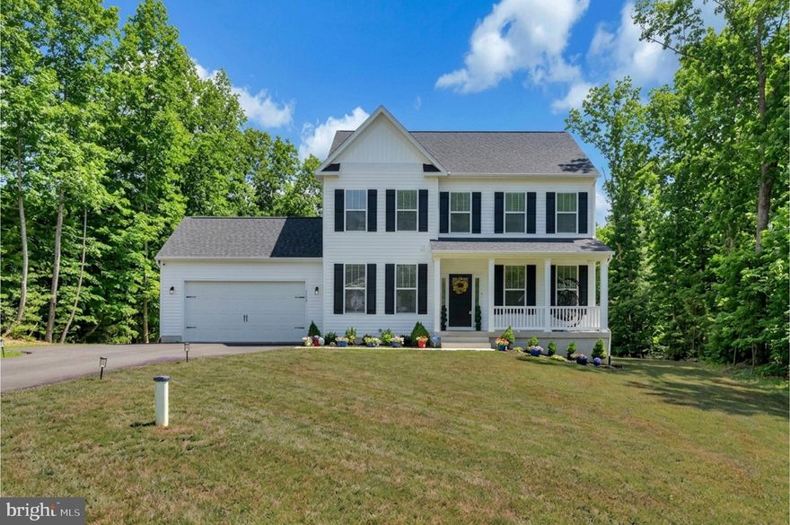 Shows like a MODEL HOME! Welcome to a Water Community! Much sought after Wyndemere! Where elevated design meets the Lake Anna lifestyle. This like-new 2024 residence on the public side offers a striking presence, refined finishes, 3 Marinas & and a boat launch/ access to the water! Gorgeous, 4 bedroom, 2 1/2 bath w 2 car garage, UPGRADED 3 dimensional roof! Carriage style Gar door, front porch for swinging!  Crown molding/chair rail, board & baton detail!Upgraded two-tone paint!  Featuring  Designer Kitchen, w/oversized quartz countertops, backsplash, beautifully crafted cabinetry with soft-close detail, recessed lighting, walk-in pantry w/barn door! UPGRADES GALORE! Seamless flow into the dining and living spaces. Enjoy beautiful Sun/Morning room w/cathedral ceiling! Ceiling fan! Overhead lights/bedrooms!   French drs to 1st floor Prof Office. Wide luxury plank flooring extends across the main level, bringing a sense of strength, continuity, and timeless appeal. Appx 2500 soft above w/ appx 1100 unfinished below. The Great Room is anchored by a wall-fireplace and framed by natural light, creating a space that feels both inviting and substantial. The owner’s suite delivers a true retreat—generous in size and thoughtfully appointed. The en-suite bath features dual walk-in closets, double vanities, a soaking tub, and a custom-tiled shower. Every element is finished with care while offering a clean, versatile backdrop ready for your personal style. Additional bedrooms provide flexibility for a variety of uses; all finished with the same elevated attention to detail. Outdoors, the amazing 20x20  UPGRADED Composite deck w/ vinyl railings expands your living space—ideal for hosting, dining, or unwinding. The huge yard offers room to enjoy, while the unfinished basement creates the opportunity to expand, design, and make the space entirely your own.  Located in the Heart of " Lake Anna" with water access, this home offers a rare blend of like-new construction, refined style, and everyday livability.  Approved Alternative Septic.  White fencing around community, waterfront picnic area,  golf carts are welcome!  Schedule your private showing today, Some Virtual Staging.  COMCAST/XFINITY Hi speed AVAIL!  Bring your Boat! MOVE IN READY! View Our Video Tour in MLS.