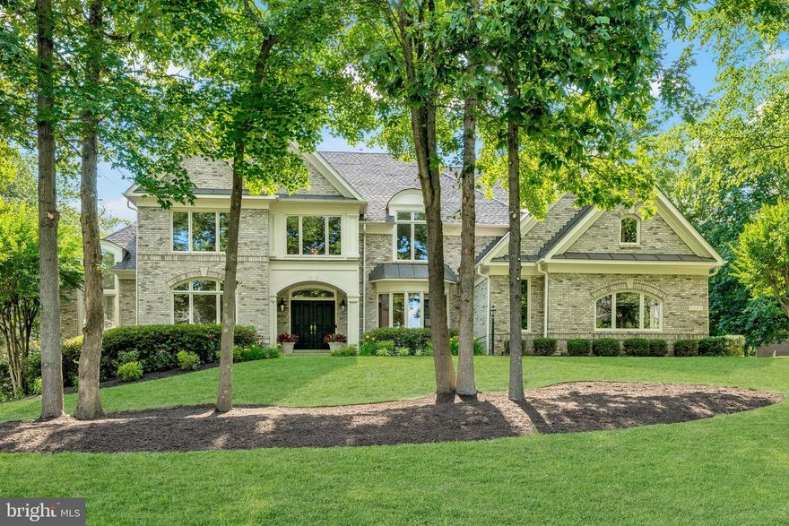 Welcome to the Estates at Longwood, a wonderful “close-in” community in Great Falls comprised of 49 estate homes, each with tall trees and gorgeous landscaping.  The original owner has meticulously maintained this special Gulick-built home, which features five bedrooms, five full baths, two half baths, and approximately 8500 finished square feet on three light-filled levels. The ideal floor plan, the main level, boasts a welcoming two-story foyer, stunning hardwood floors, impressive windows, decorator lighting, expansive principal rooms, doors to a large custom deck, and a convenient second staircase.  The upper level features an elegant primary suite with a separate sitting room with a door to a large deck, gas fireplaces, a custom walk-in closet, and a spa-inspired bath.  There are 3 additional bedrooms, two full baths, and a second laundry room on the upper level. The walk-out lower level with luxury vinyl plank flooring is the home's entertainment hub, boasting a large recreation room, media room, exercise room, ensuite bedroom five with gas fireplace, guest bedroom, and additional bonus and storage rooms.  This is the perfect place to call home!