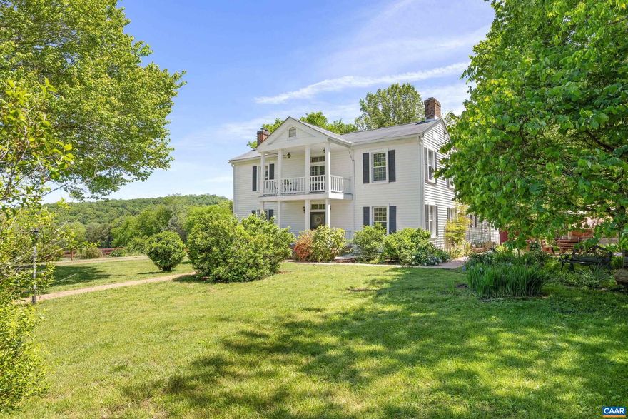 Once a tavern and later a B&B, this enchanting 5BR/5.5BA farmhouse blends history, character, and rural beauty. Set on 20+ acres, it?s designed for a sustainable lifestyle with fenced pastures, a fenced vegetable garden featuring perennial herbs and medicinal plants, a creek, private pool, poolhouse, and multiple outbuildings?including a barn, stable, and greenhouse. A remarkable historic touch: the foundation of Fluvanna County?s original jail, dating back to 1777, still stands on the property. Inside, original woodwork, wide plank floors, working fireplaces, and 19th-century charm grace spacious gathering rooms and bedrooms. The farmhouse kitchen features butcher block counters and timeless style, while sun-drenched living areas open to wraparound porches and panoramic rural views. Additional highlights include a rustic wine cellar, upper balcony perfect for stargazing, and magical outdoor spaces ideal for entertaining or peaceful reflection. Convenient to town yet privately nestled among mature trees and trails, this property is a rare opportunity to garden, host, rest, and roam?all in one unforgettable place to call home.,Wood Cabinets,Fireplace in Basement,Fireplace in Bedroom,Fireplace in Dining Room,Fireplace in Family Room,Fireplace in Living Room