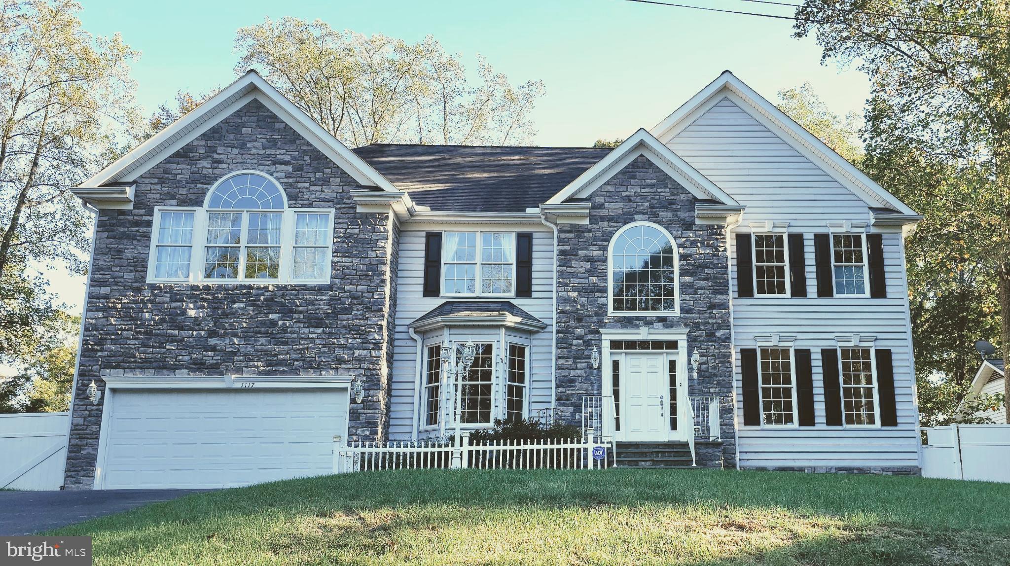 Discover an unparalleled lifestyle in this exquisite Colonial residence nestled within the desirable Aquia Harbour community. This stunning home, boasting 6 spacious bedrooms, and 4.5 bathrooms with over 4600 finished square feet of living space. This residence combines modern amenities with a serene suburban lifestyle. The gourmet kitchen is a chef's dream, featuring upgraded countertops, a generous sized island, and SS appliances. The open floor plan seamlessly connects the kitchen to the family room, where a cozy stone fireplace serves as the centerpiece, inviting warmth and relaxation. Elegant details such as chair railings, built-ins, and luxurious wood and ceramic tile flooring enhance the home's charm, while the primary suite offers a private oasis with a soaking tub and walk-in shower. The upper level is complete with an inlaw suite with full bath and walk in closet. The fourth and fifth bedroom share a Jack & Jill styled bathroom. The fully finished basement, provides additional living space with two generous sized bedrooms, a game room with pool table and kitchenette/ wet bar perfect for entertaining or unwinding after a long day. Outside, the property is equally impressive. The landscaped lot lined with fruit trees featuring a water fountain, a covered porch with electric awnings that invites you to savor the serene surroundings. The attached garage accommodates two vehicles, while the asphalt driveway offers ample off-street parking for guests. Aquica Harbour is not just a community; it's a lifestyle. Residents enjoy exclusive access to a wealth of amenities, including basketball courts, tennis courts, a marina, and scenic walking trails. The gated community ensures privacy and security, allowing you to fully embrace the tranquility of suburban living while remaining close to vibrant recreational opportunities. This property is available for lease starting October 21, 2025, with flexible terms ranging from 12 to 24 months. Experience the luxury and comfort of this exceptional home, where every detail has been thoughtfully curated to elevate your living experience.