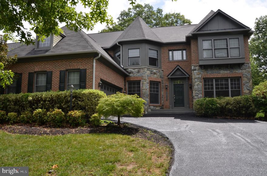 OPEN HOUSE CANCELLED!  Just Stunning! The moment you walk into this modern spacious 5 Bedroom,4.5 bath Colonial you will be amazed! Larger than most; boasting of over 6,000 square feet, this home is waiting just for you and has everything on your wish list!  Upon entering the formal foyer, you'll be immediately struck by the main living areas, featuring stunning wood hall and kitchen floors, formal Living Room, formal Dining Room, Library/Office, Family Room, Sitting Room and Gourmet Kitchen. The kitchen boasts marble counters, a grand center island, stainless steel appliances, and a refrigerator that blends seamlessly into the cabinets.  Entry into the large 2-car garage from the kitchen. Upstairs, you'll find four bedrooms and three full bathrooms, including the primary suite, which has two large walk-in closets and a luxurious bathroom with dual vanity sinks, a glass-enclosed shower, and soaking tub., complete with a nice size sitting room.  Three more bedrooms on the upper level, one of which also boasts an en-suite bathroom. The very large, finished basement features a 5th bedroom or possibly 2nd office, music room or gym. All with another full bath. Plenty of room for storage in the unfinished but very large utility room. Recessed lighting and elegant upgrades added throughout the whole house.  You won’t want to leave!