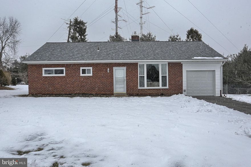 Solid brick 1-story rancher in quiet Penn Manor neighborhood, 3 bedrooms, 1 1/2 baths, Many updates...  Updated kitchen cabinets, backsplash, & countertops, new heating system, new roof, new windows, new flooring & paint throughout, new gas fireplace, new garage, eat-in country kitchen, Living room with brick fireplace, & big picture window, updated bathrooms, large flat back yard to entertain family & friends.