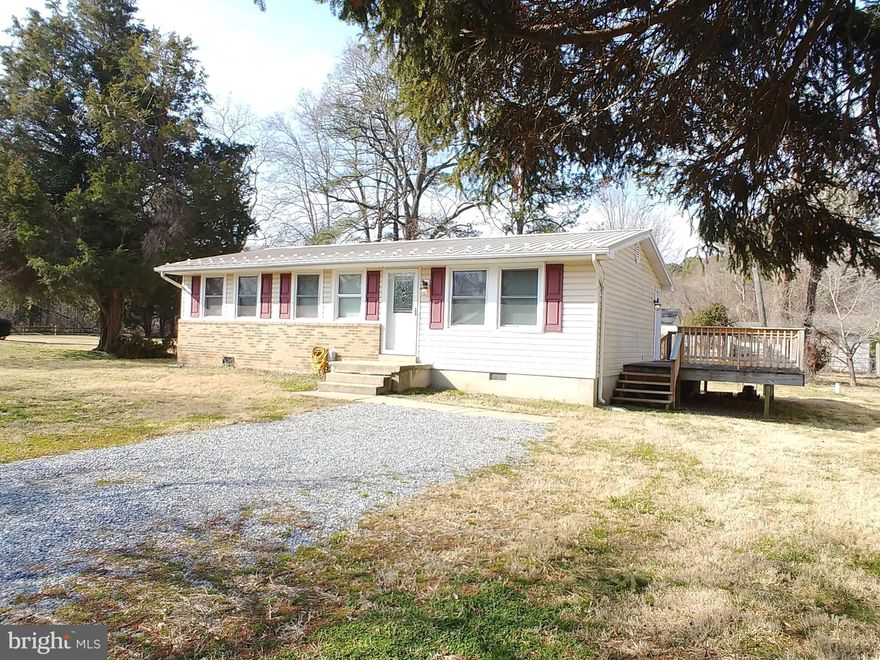 Home was completely remodeled 1 year ago and features:  New kitchen cabinets, new counters, new stainless steel appliances, new flooring, new metal roof, new HVAC, new bathroom vanity. Home also comes with a washer, dryer, deck, and shed and was just recently power washed. Come enjoy Golden Beach, a water access community, featuring 3 docks, beach, tot lot, basketball court, and boat ramp. Sure to please all buyers.