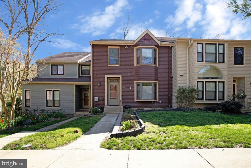 Tucked among the trees in the sought-after Woods Landing community, this inviting contemporary 3 bedroom, 3 full, 1 half bath townhouse blends comfort with a warm, rustic feel. Inside, wood floors set the tone for a home that feels both grounded and welcoming. The kitchen is outfitted with stainless steel appliances, granite countertops, and a sunny bay window—perfect for morning coffee. A separate dining room offers space for gatherings, while the cozy family room features a striking stone fireplace and built-in shelving, and opens to a private deck that looks out over peaceful woods. Upstairs, the primary suite feels like a retreat with its vaulted ceiling, walk-in closet, private balcony, and spacious bath. Two additional generously sized bedrooms share a full bath. The finished lower level adds even more living space with a full bath and walk-out access to a private deck, ideal for quiet evenings outdoors. Residents of the Woods Landing community enjoy exceptional amenities including scenic walking trails, an observation tower with views of the Little Magothy River, a dog park, playground, tennis and pickleball courts, and convenient boat storage. Enjoy nature at your doorstep.
