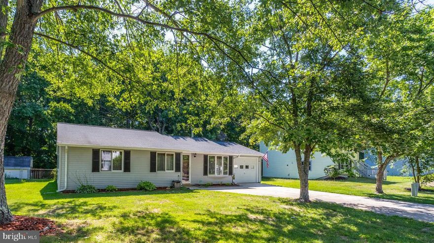 Beautiful rancher overflowing with charm.  Stylish interior upgrades throughout the house, Wood floors, updated windows, and a Woodstove (updated ) heat the whole house for cozy, warm winters. Gorgeous kitchen with granite counters, updated cabinets, and stainless steel appliances.   Updated bathroom, walk-in closet w/organizers, and unique vanity area for the lady of the house. Enjoy your backyard with style.  The patio area is set up for cozy fireside chats.  Deck area off the kitchen for social  BBQ gatherings. Outside gardens are a peaceful place to enjoy late afternoon iced tea. Since the photos were taken, the owner has added laminate flooring to all the bedrooms.. Photos were taken before the sellers moved. The home is vacant and professionally cleaned, ready for new owners.