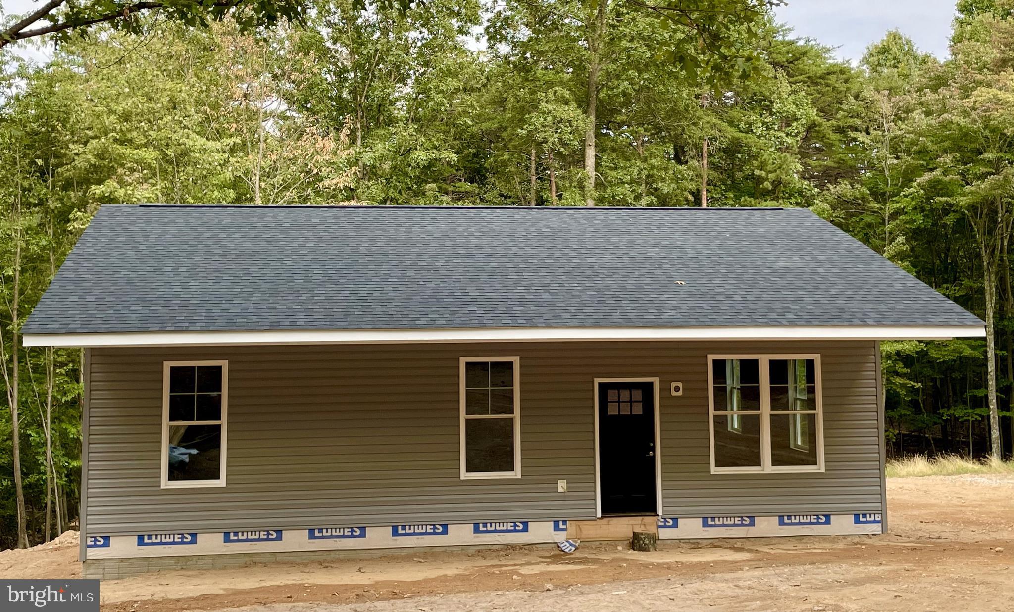 Delivery date is mid-August 2024!! Embrace the tranquility of country living in this stunning new build, perfectly situated on 2.5 unrestricted acres of picturesque landscape. Designed for comfort and modern convenience, this home boasts an open living room and kitchen adorned with vaulted ceilings, creating an inviting atmosphere.
The heart of the home is the kitchen, featuring quartz countertops, a sizable 5x6 island, and stainless-steel appliances, ideal for culinary enthusiasts and entertaining guests alike. The 9-foot ceilings throughout the home accentuate the contemporary design.
Relax and unwind on the full front porch, overlooking the serene surroundings and offering a perfect spot to enjoy morning coffee as you watch the wildlife or evening sunsets. With unrestricted acres, the property offers endless possibilities for outdoor activities, from gardening to recreation.
Conveniently located just 30 minutes from Winchester and within a 2-hour drive from DC and Baltimore, this home offers the perfect balance of seclusion and accessibility. Additionally, it's only 10 minutes away from public stream access, ideal for fishing and outdoor enthusiasts.
Experience the serenity and charm of rural living with all the modern amenities you desire. Don't miss out on this exceptional opportunity—schedule your private tour today and envision the possibilities of making this tranquil retreat your new home.
Owner/Agent