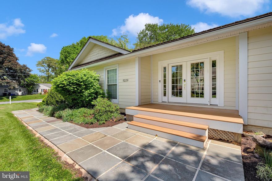 Welcome to this beautifully updated contemporary style home in the highly sought-after Luxmanor neighborhood, ideally situated on a prominent corner lot. This expansive residence offers a seamless blend of classic architecture and modern upgrades, featuring thoughtfully designed living spaces and exceptional indoor-outdoor flow.

Step inside to discover a light-filled main level enhanced by skylights, high ceilings, and floor-to-ceiling windows that flood the home with natural light. The inviting living room is anchored by a fireplace and opens directly to the backyard, creating a perfect connection for entertaining. The kitchen features an island layout, refreshed with a new backsplash, freshly painted cabinetry, and updated appliances including a new dishwasher and stovetop, and flows effortlessly into the adjoining dining area and family room with fireplace.

The main level continues to the bedroom wing, including a spacious primary suite with elevated ceilings, an en-suite bath, and direct access to the pool area, providing a true retreat-like feel. Three additional bedrooms, 2 full baths, and a laundry room are thoughtfully arranged for comfort and convenience.

The fully renovated lower level expands the home’s versatility, featuring a brand-new guest suite with a full bath and closet, a custom-built wine cellar and tasting room, exercise space, a home theater, and a large recreation room with walk-out access to the backyard.

Outdoor living is equally impressive, with a private backyard oasis including a beautiful, large pool, hot tub, patio area, and expansive yard complete with a treehouse and zipline, ideal for relaxation and entertaining. Recent exterior upgrades include a new driveway and front walkway, enhancing both curb appeal and functionality. Additional notable improvements include: two new AC units, new washer and dryer, new epoxy garage floor with fresh paint. 

Located within the Luxmanor Elementary, Tilden Middle, and Walter Johnson High School cluster, this home offers both convenience and a premier neighborhood setting.  A rare opportunity to own a move-in-ready contemporary home with exceptional upgrades, architectural charm, and resort-style outdoor living in one of the area's most coveted communities.