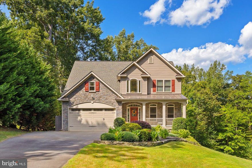 Beautiful home in desirable Fox Chase! Situated on a very private 1.22 Acre lot, this is one of the newer homes built in the neighborhood.  From the large Rocking Chair Front Porch, you enter into the Bright 2 Story Foyer with Gorgeous Hard Wood Flooring that flows into the Formal Dining Room with Tray Ceiling and Crown and Chair Moldings or to the Beautifully Appointed Kitchen with Granite Counter Tops and Upgraded Soft Close Cabinets. This is a wonderful place to create meals or just hang out with family and friends as it adjoins the comfortable Family Room featuring Gas Fireplace, and it also opens up to the Amazing Deck that overlooks your Private Backyard!  Upstairs you will find the Primary Suite with Vaulted Ceiling and Accent Lighting that opens onto the Upper Balcony. The Primary Bath has Vaulted Ceilings with Accent Lighting along with Double Vanity, Upgraded Counter Tops, Deep Garden Tub, Large Walk In Shower and Walk In Closet! On the Upper Level you will also find 2 more Large Bedrooms, one of which also opens to the Upper Balcony, and another Upgraded Full Bath. The Lower Level is a great area to entertain with a 2nd Gas Fireplace with Stone Surround and a Beautiful Bar with an Under Counter Refrigerator!  This area has it's own half bath and walks out to the yard!  This is a Wonderful Home where you can enjoy living in this Gorgeous Neighborhood with it's own Pool, Walking Trail, Playground  and Lake.