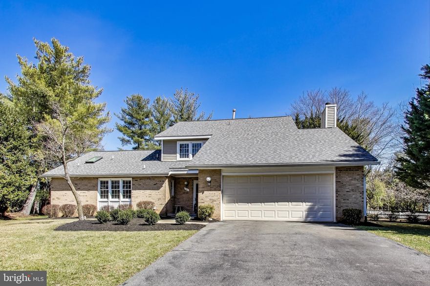 Brick Front Contemporary with over 4,700 sq feet located on cul-de-sac– largest model in Flints Grove community – Main Level Primary Bedroom with dual walk-in closets, attached office/nursery, vaulted ceilings and ceiling fan – Renovated Ensuite Primary Bathroom with dual vanity sinks, jetted soaking tub, walk-in shower with glass walls/door & skylight - Formal Living & Dining rooms with hardwood flooring, crown molding and windows overlooking private rear yard – Dining room with recessed lighting, chair railing and wainscoting – Expanded kitchen with granite countertops, tile backsplash, under light cabinets, stainless steel appliances, upgraded beech cabinets with soft close drawers & pullout pantry shelves – Family room off kitchen with stone fireplace & built-in cabinets – Crown molding & recessed lighting in Kitchen and Family room – Upper level with 3 large bedrooms, all with ceiling fans & renovated full bathroom with water closet with shower/tub – Huge finished lower level with recessed lighting and full bathroom – Flat level yard with rear deck -  Newer  Architectural Roof - Minutes to shopping & restaurants at Kentland, Rio, Crown, & Falls Grove -Thomas Wootton High School -