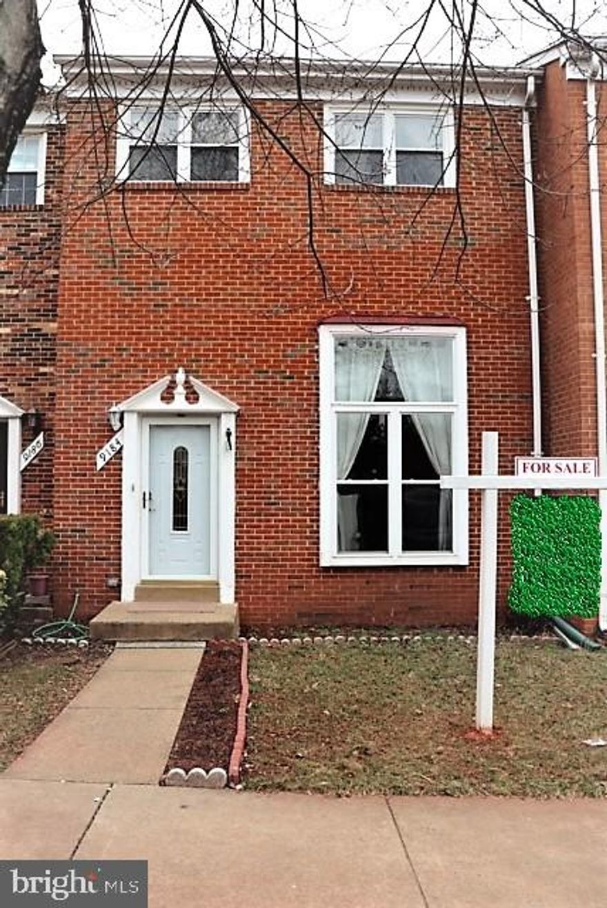 BRICK FRONT HOME ON CUL DE SAC STREET - 1,650 FINISHED SQUARE FEET - UPDATED KITCHEN & BATHROOMS - KITCHEN HIGHLIGHTED BY DARK MAPLE CABINETS, GRANITE COUNTERS & STAINLESS APPLIANCES - VINYL CLAD DOUBLE WINDOWS - HARDWOOD ON MAIN LEVEL - LOWER LEVEL RECREATION ROOM WALKS OUT TO DECK & FENCED REAR YARD - UPPER LEVEL FEATURES TWO FULL BATHS - MINUTES TO MANASSAS VRE - RESERVED PARKING. First Time Home Buyer Dream." Bed of Tulips just planted for spring blossom.