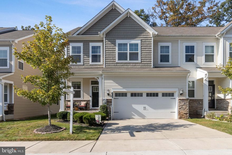 Nestled in the desirable executive community of Holly Ridge, this spacious and upgraded end-unit townhome offers the perfect blend of modern convenience and suburban tranquility. With 4 bedrooms and 3.5 bathrooms, this meticulously maintained showcase home is ready to be your new sanctuary.
Why buy new construction when you can have an “almost new” home that screams luxury and upgrades and has all the builder kinks addressed? From the enhanced elegant crown molding in many of the rooms to the genuine wide plank hardwood flooring in the main level. New ceiling fans have been installed and recessed lighting complements the huge windows, some with blinds already attached. Imagine the cost to add a sturdy privacy fence and a professionally designed stone patio. You save thousands of dollars in many ways. 
Did we mention the possibility of a unicorn 2.25% VA loan interest rate that could potentially be assumed for a qualifying buyer? 
🌟 Lets get to the Key Features of this delightful property 🌟
✨ A Spacious Living retreat: Step inside and be greeted by an open, sun-filled foyer that is your introduction to this sophisticated residence. An open plan layout that welcomes you with warmth and comfort. The generous living area offers plenty of room to relax and entertain guests.
✨ A gourmet Kitchen featuring an expansive island that is a statement of grandeur. The chef in you will adore the upgraded space with sleek stainless-steel appliances, plenty of granite countertops, and ample cabinet space. Cooking and hosting dinner parties will be a breeze!
✨A huge fully Finished Basement is a rare treat in this community: This young home comes with well thought out basement that can be transformed into whatever make you happy. Currently an impactful upgraded theater surround sound with modern designed full wall framed viewing screen. Just bring the popcorn. The 4th bedroom is more than comfortable and complimented by the 3rd full bath. The possibilities here are endless! 
✨ Outdoor Oasis: Enjoy the beauty of the outdoors from your very own beautiful patio, perfect for sipping morning coffee or hosting summer BBQs. The privacy fence ensures your peaceful oasis remains secluded. The location of this home is ideal. Tucked back in the community with a natural treed backdrop rather than looking in to your neighbors kitchen. 
✨ End-Unit Advantage: As an end unit, you'll relish the added privacy and space, making this townhome feel like a detached home without the hefty price tag.
✨ Primary Suite Retreat: This grand bedroom is a true retreat with a huge en-suite bathroom and duel walk-in closets, providing you with a serene escape at the end of the day.
✨A 2 car garage and additional apron parking for 2 more cars completes the picture. Storage inside is also an upgrade. A front porch to relax on or decorate for every holiday. 
✨ Abundant Storage: Tons of storage space throughout the home means you can keep everything organized and clutter-free.
✨ Location, Location, Location: Located in the desirable Glen Burnie area, you'll have easy access to shopping, dining, parks, and major commuting routes. Fort Meade is 14 miles away, 
Why buy new and overpay for everything when you can have a young, well-maintained home that already boasts all the upgrades you desire?