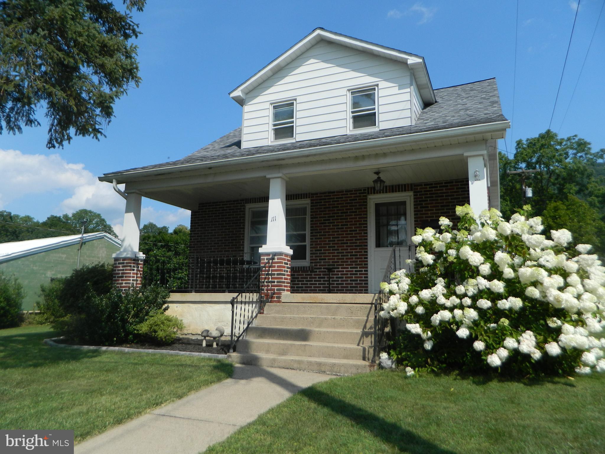 This adoring charmer in Pleasant Gap will make you feel at home from the moment you walk in. As a classic 1930s cape cod, it has that cozy feel to it that you want, while, at the same time, offering a large owner's bedroom, a newer roof, a detached garage with loft storage, and more! The nice front porch welcomes you to the home as you walk through the front door into a nice sized living room with hardwood floors. Eat your meals in the dining room or the kitchen with a newer tiled floor. The Laundry is handily accessible right off the kitchen as is a mudroom with a full bath adjoined. Upstairs has two bedrooms. The primary bedroom is large and has access to the attic. Another nice bedroom, and full bathroom (with a 5 x 11walk-in closet) rounds out the upper level. Outside you can enjoy a flat open side yard with a fruitful grape vine. Out the backside of the home is a driveway for two cars and a detached garage with plenty of space for storage both on the main level and in the loft above. Nestled on a quiet side street in Pleasant Gap, this wonderful home beckons you. Call for a showing today.