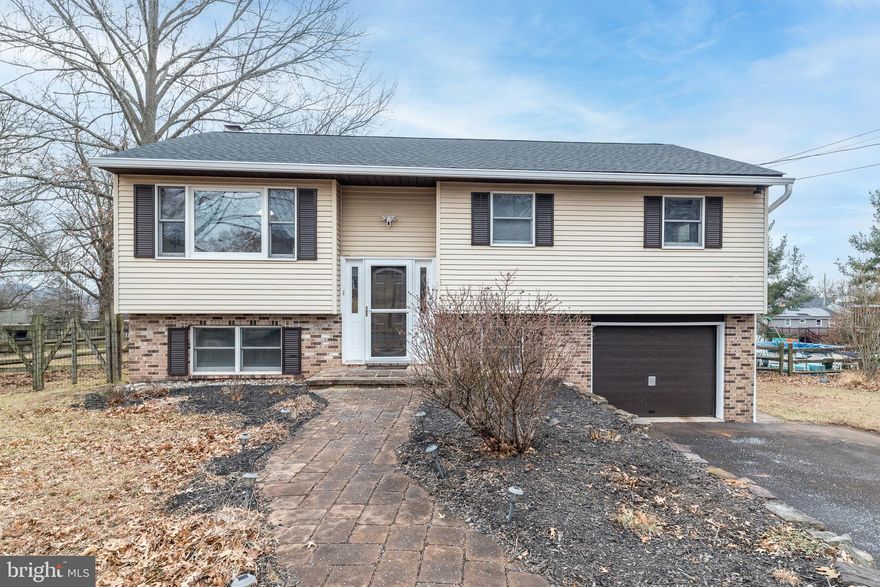 OPEN HOUSE CANCELLED 1/17/26 DUE TO WEATHER!!  OFFER DEADLINE SUNDAY, 1/18/26 at 8:00 pm. Thank you! Welcome to this beautifully maintained 3 bedroom, 2 full bath, bi-level home, offering both comfort and functionality for today’s homeowners. Nestled on over a quarter-acre of land in desirable Upper Pottsgrove Township, this property provides ample space inside and out for relaxation, entertaining, and everyday living.
As you walk in the front door, you will walk up a few wood steps and find a spacious, open concept, living area with newer (2024) luxury vinyl plank flooring, a ceiling fan, and a large picture window with adjacent side windows allowing for lots of natural light.  The newer luxury vinyl plank flooring extends throughout the main level of the home, including the kitchen, dining area, hallway, and three bedrooms. The living area flows into a dining area that you can use as a formal dining area, or as an eat-in kitchen concept. From the dining area, you can enter the kitchen with oak cabinetry, neutral tile backsplash, oversized stainless sink,  and Corian countertops, or you can exit the dining area through the sliding glass doors and access the wood deck overlooking the expansive, fenced-in rear yard, perfect for entertaining. 
On this same level, you will find three good-sized bedrooms, each with a ceiling fan and ample closet space.  The large hall bath features a double sink, and tiled jetted tub/shower.
As you walk down to the finished lower level, you will find a large family room with a brick- faced wood stove, recessed lighting, and a full bath with stall shower. This level also features an extra room with a front-facing window that can be used as an office, exercise room, recreation room, or whatever your needs may be. Across from this bonus room is the large laundry room with built-in shelving, and included front loading LG washer and dryer. The home’s oversized one-car garage is a rare find, complete with a storage area and wood workbench—perfect for hobbies, projects, or keeping your belongings organized. You can access the garage from inside the home and/or the rear yard. Recent updates include a newer roof installed in 2021, newer toilets (2022), newer luxury vinyl plank flooring  (2024), and new gutters (2025). A shed out back will hold all your lawn and landscaping needs.
This bi-level property perfectly combines modern upgrades with classic comfort. With a move-in ready experience, an exceptional garage, and abundant indoor and outdoor living spaces, this home blends quality, space, and value in a delightful setting. Don’t miss your chance to make it yours! Schedule a tour today and imagine the possibilities!