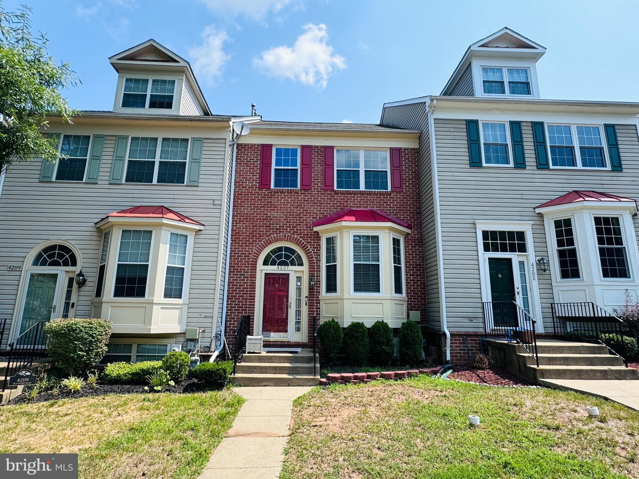 This Gorgeous Home features *3 Level Bump-Out *Large eat-in Kitchen w/ ss appliances, lovely black granite countertops & 42" white oak cabinets *Beautiful wood floors on 1st level *Deck off family rm area *Master BR w/ cathedral ceilings & the en suite has a skylight *Basement has a fireplace, 4th BR & full bath perfect for an in-law suite *