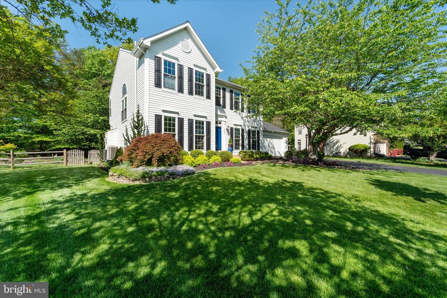 Welcome to this stunning single-family home in the desirable Meadowbrook Woods community! Situated on over half an acre, you'll notice the beautiful landscaping and lawn, which sets the tone for a peaceful retreat. The interior of the home boasts a formal dining room, perfect for special occasions, and a cozy living room/sitting room ideal for relaxation. A powder room provides convenience for guests, while the large family room, adjacent to the kitchen, is perfect for family gatherings. The kitchen features granite countertops and stainless steel appliances, making meal prep a breeze. A bright sunroom off the kitchen leads to the deck and patio, where you can enjoy the fenced rear yard and take in the view of your wooded backyard. The gorgeous built-in Pergola is the perfect spot to unwind and entertain. Upstairs, the primary bedroom is a serene oasis, complete with a walk-in closet and a stunning, renovated spa-like bathroom. The bathroom features a rain shower, upgraded plumbing hardware, a frameless shower door, and a gorgeous pedestal tub, which creates a relaxing retreat. Three additional spacious bedrooms on the upper level share a beautifully renovated hall bathroom. The finished lower level offers ample storage, a full bath, rec room , and a home gym. Additional features include a whole-house humidifier and sauna, making this home a true haven. Recent updates include new front windows on both levels, upgraded lighting, crown molding, and chair rail, adding a touch of sophistication to the interior. The roof is just two years old, and the water heater and HVAC are in good working condition. Don't miss out on this incredible opportunity to own a piece of paradise in Meadowbrook Woods, an active community with pool, swim team, calendar of events, and zoned for the highly rated school tier of Marshall ES, Benton MS, and Colgan HS.