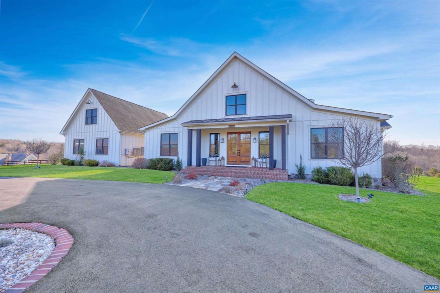 Welcome to this exceptional 5BR, 3.5BA custom-built home offering modern living in a peaceful setting. Hardwood floors, custom cabinetry, and two gas fireplaces highlight the interior, along with dual fuel HVAC, solar panels with battery and whole-home generator backup, tankless water heater, Level 2 EV outlet, and security with exterior monitoring.  The kitchen features a 9? island, granite and Carrera marble countertops, open shelving, a walk-in pantry, and KitchenAid commercial-style appliances including a 6-burner gas cooktop, wall oven, microwave/oven combo, French-door refrigerator, dishwasher, and wine fridge. The loft-style primary suite offers a private balcony, oversized custom walk-in closet, loft office space, and spa-like bath with soaking tub, dual sinks, and large shower. Guest bedrooms share a connecting bath with dual sinks and walk-in shower. A rec room opens to the back porch, and a finished suite above the 3-car garage offers 2 additional bedrooms. Outdoors enjoy TimberTech decking, stone firepit, fenced pasture, custom barn, paved drive, year-round stream, and private trails, all under 15 minutes to Rivanna Station and Hollymead Town Center. Offering a VA assumable loan at 2.75% ( $927K) for qualified buyers.,Granite Counter,Marble Counter,White Cabinets,Wood Cabinets