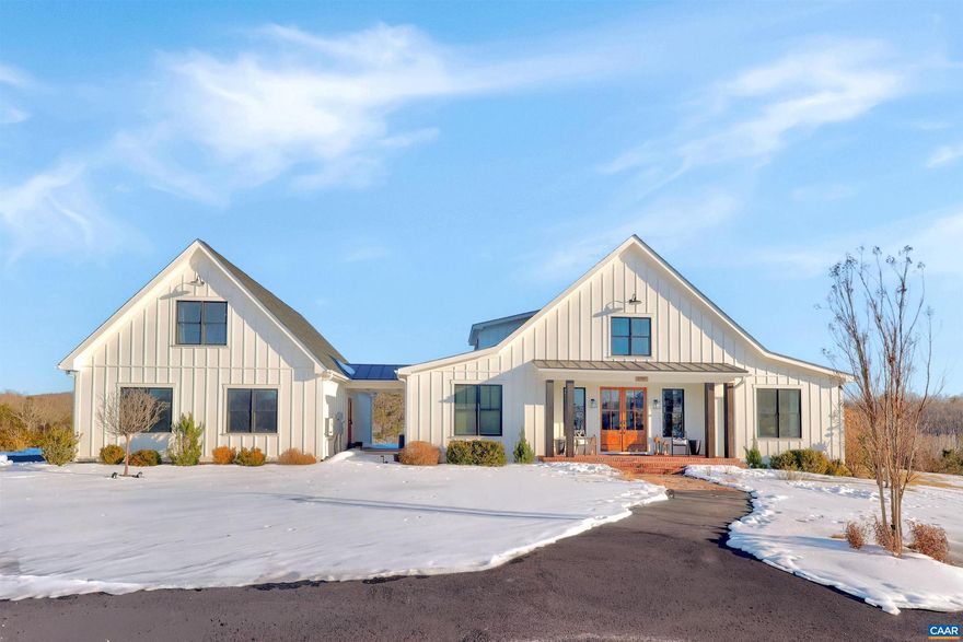 Welcome to this exceptional 5BR, 3.5BA custom-built home offering modern living in a peaceful setting. Hardwood floors, custom cabinetry, and two gas fireplaces highlight the interior, along with dual fuel HVAC, solar panels with battery and whole-home generator backup, tankless water heater, Level 2 EV outlet, and security with exterior monitoring.  The kitchen features a 9? island, granite and Carrera marble countertops, open shelving, a walk-in pantry, and KitchenAid commercial-style appliances including a 6-burner gas cooktop, wall oven, microwave/oven combo, French-door refrigerator, dishwasher, and wine fridge. The loft-style primary suite offers a private balcony, oversized custom walk-in closet, loft office space, and spa-like bath with soaking tub, dual sinks, and large shower. Guest bedrooms share a connecting bath with dual sinks and walk-in shower. A rec room opens to the back porch, and a finished suite above the 3-car garage offers 2 additional bedrooms. Outdoors enjoy TimberTech decking, stone firepit, fenced pasture, custom barn, paved drive, year-round stream, and private trails, all under 15 minutes to Rivanna Station and Hollymead Town Center. Offering a VA assumable loan at 2.75% ( $927K) for qualified buyers.,Granite Counter,Marble Counter,White Cabinets,Wood Cabinets