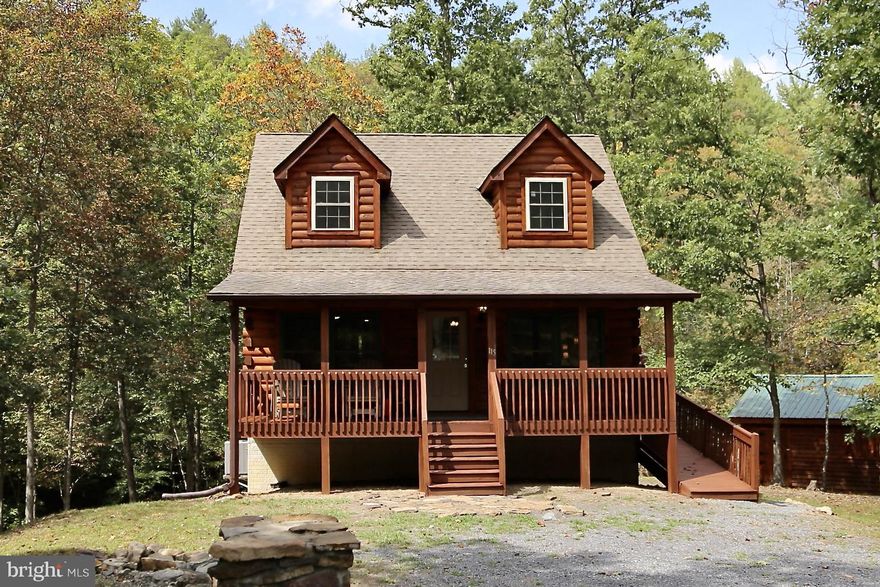 Welcome to this hidden treasure, a cozy 2-bedroom, 2-bathroom log cabin nestled on a 2.42-acre parcel. Stone fireplace insert. The large back deck overlooks a backyard stream, providing the perfect escape! The basement is unfinished, but has the rough-in plumbing ready for your own creativity. Cabin has been refreshed with a new English Walnut stain! Large storage shed. High speed fiber-optic available! Located minutes from the Town of Wardensville for shopping and restaurant. 30 minutes away from Winchester, VA. Less than 2 hours DC. Be sure to check out the virtual tour! Schedule your showing today!