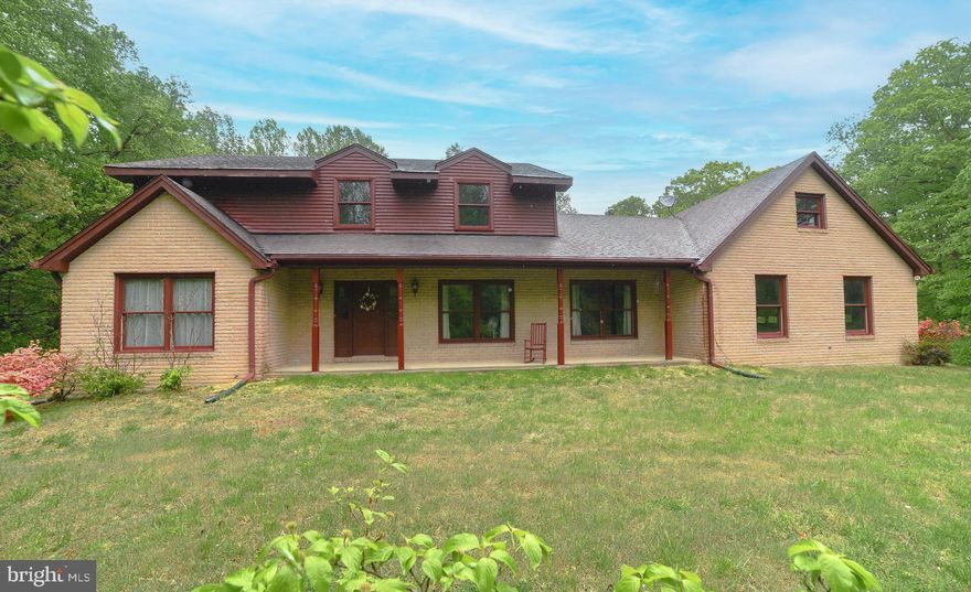 ALL the space you need inside AND out!  Almost 7 acres of yard, woods, creek and privacy! The house boasts FIVE bedrooms, 3.5 baths starting with one primary on the first floor with it's own bath, another half bath for guests and no need to turn a bedroom into an office because this home already has a designated office ready for your zoom meetings.  With a formal living room and dining room plus a large family room right in the middle of the home there is a place for everyone.  This family room has a view of the backyard, fireplace and exposed beams for that cozy feel.  You'll love the remodeled kitchen because these custom cherry cabinets were constructed by the Amish with granite counters and new stainless steel appliances.  There's a laundry/mudroom off the kitchen to clean up after outdoor play, then upstairs 4 more bedrooms and 2 additional bathrooms.  This includes another master bedroom.  Hardwood floors throughout the home, crown molding, fresh paint and an unfinished basement for storage complete everything you need.  And if you want even more land, the adjoining property is also for sale!