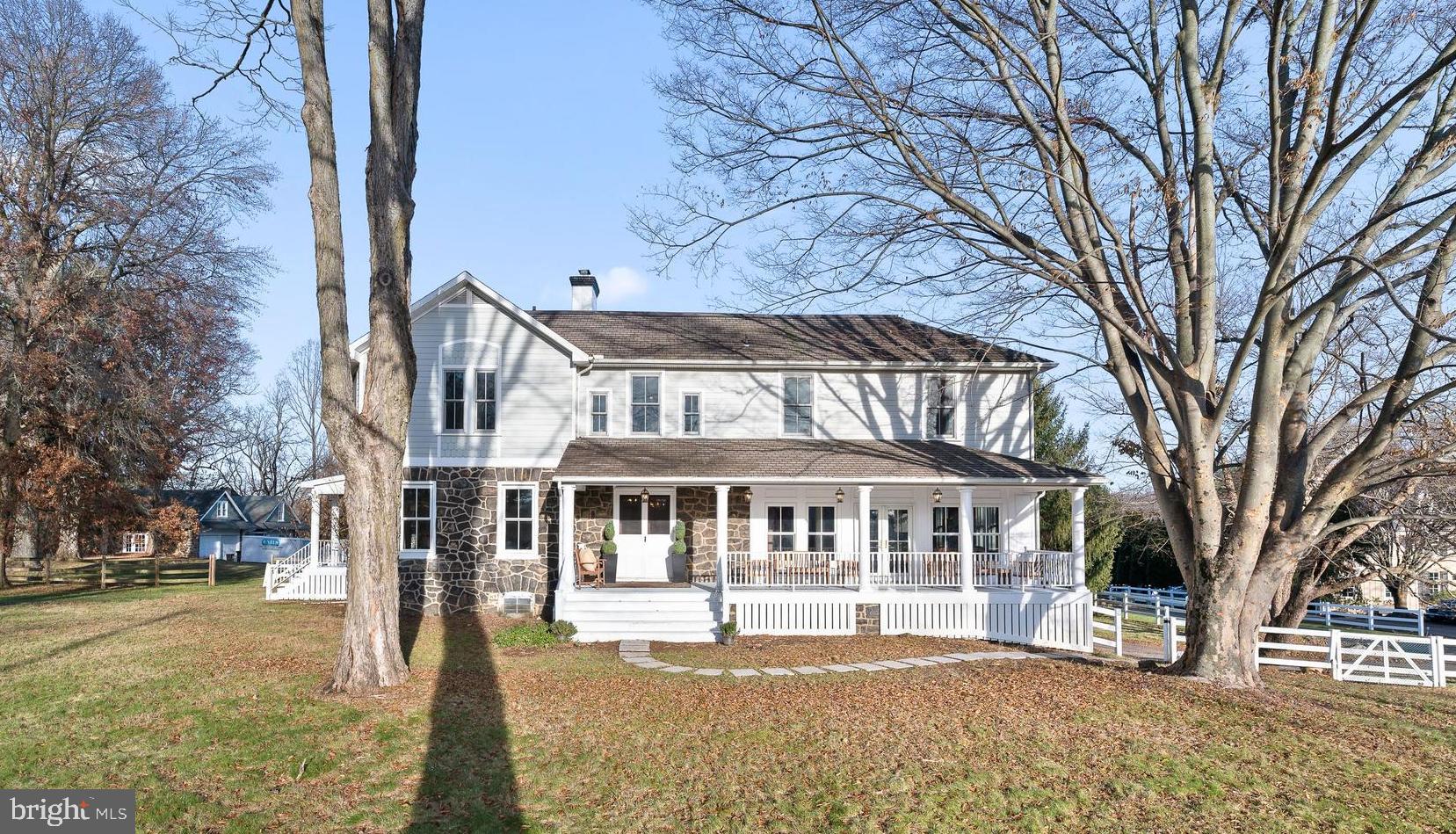 Built in 1895 on an expansive 1.89 acre lot sits an idyllic Chester County farmhouse with separate carriage house. The next lucky stewards of 501 Newtown Road will enjoy the high ceilings, gracious room sizes, hardwood flooring throughout, beautiful moldings, and two breezy porches. Get the best of both worlds: the charm of an older home with today’s modern amenities and updated plumbing, high efficiency windows, central air conditioning, and an updated electrical system. The first thing you will notice is the welcoming front porch, the perfect place to leisurely hang out during the warmer months. Enter through the original double front door to the center hall with a half bath tucked under the steps and a cozy fireplace with detailed ironwork. Flow into the formal living room with fireplace and ample windows, bathing the room in natural light. The eat-in kitchen features wood cabinets with granite countertops, gas JennAir range with grill, desk area and breakfast room with skylights. Through a cool dutch door is a sunny office, leading to the huge family room addition with built-in speakers and windows on three sides is ideal for game night or watching a movie. Some architectural details in this room are an exposed stone wall and embossed ceiling. The back door area includes a mudroom with slate flooring, a quaint window seat with storage, double coat closet and a half bath. Off the mudroom are French doors to a side covered porch for alfresco dining. Take either the front of back stairs to the second level which includes three full bathrooms and four bedrooms. (a fifth bedroom was converted into two large walk-in closets in the primary suite.) There are three nice-nice-sized bedrooms and two hall bathrooms, both with a shower/tub combo. The primary suite boasts an updated bathroom with double vanity and large shower with six heads/body sprays. A convenient second floor laundry room completes this floor. The separate stone carriage house consists of a 2 car garage with a small apartment above and a separate apartment on the right side with living room, kitchen, eating area, office, full bathroom, laundry room and 2 bedrooms upstairs. Public water and sewer. Close to shopping and dining destinations along Philadelphia's famed Main Line. Top-rated Tredyffrin-Easttown Schools as well as close proximity to a plethora of highly regarded private schools. Easy commuting to Philadelphia or NYC with AMTRAK service at the nearby Paoli Station.