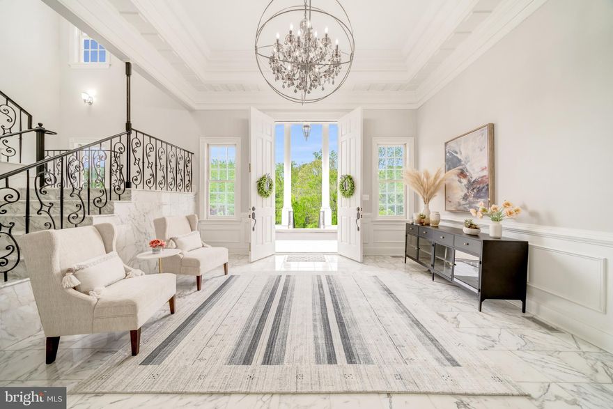 An exceptional opportunity to lease a premier estate awaits in the serene setting of McLean, Virginia, just outside of Washington, DC.  Enter through the private gate and behold this majestic Neoclassical-inspired mansion sitting atop a hill overlooking just over 1.6 acres of lush greenery.  Delight in the Japanese Maples, Dogwoods, and Crape Myrtle trees that gracefully line the two-tiered portico driveway, which provides a path to the dramatic front entrance or around the corner to the three-car attached garage.  The open floor plan of this luxury residence encompasses nearly 13,000 square feet of tastefully designed and fully furnished living space, boasting seven bedrooms, seven full baths and two half baths.  The heart of the home, the striking gourmet kitchen, features top-of-the-line Thermador appliances, and is fully stocked with dishes, cutlery and cooking utensils, offering functionality, convenience, and style.  Immerse in luxury as you enter the grand foyer, which offers a direct sightline through the circular lounge to the rear lawn.  White marble floors adorn the main and lower levels, providing a sophisticated ambiance that perfectly complements the stylish furnishings throughout. With ceilings soaring to 14 feet and adorned with classic moldings, every inch of this home is a feast for the eyes.  A graceful marble staircase leads you to the second level.  Or, if you prefer, take the three-level elevator instead.  On the second floor, fully appointed suites line the hallway, which ends in a dramatic arched window. The primary suite exudes grandeur, featuring a fireplace, and an opulent marble-tiled spa-like bath with rain-shower and separate soaking tub. Each upstairs room offers the convenience of its own en-suite bathroom, ensuring the utmost in comfort and privacy for guests.  The 4,000+ square foot lower level boasts oversized bar for entertaining and a sauna for relaxing.  French doors lead out to a massive flagstone patio, furnished with a lounging area, dining area and grill.  Ideally suited for embassies or executives, the convenient McLean location offers easy proximity to Washington, D.C., Capitol Hill, Tysons Corner, local airports, and other key destinations.  Yet, the home feels miles away from the hustle and bustle of it all, tucked away from the main roads and surrounded by verdant space.  Please note that viewings are available by appointment only and require 24-hours advance notice.  Contact the listing agent to schedule your tour today!