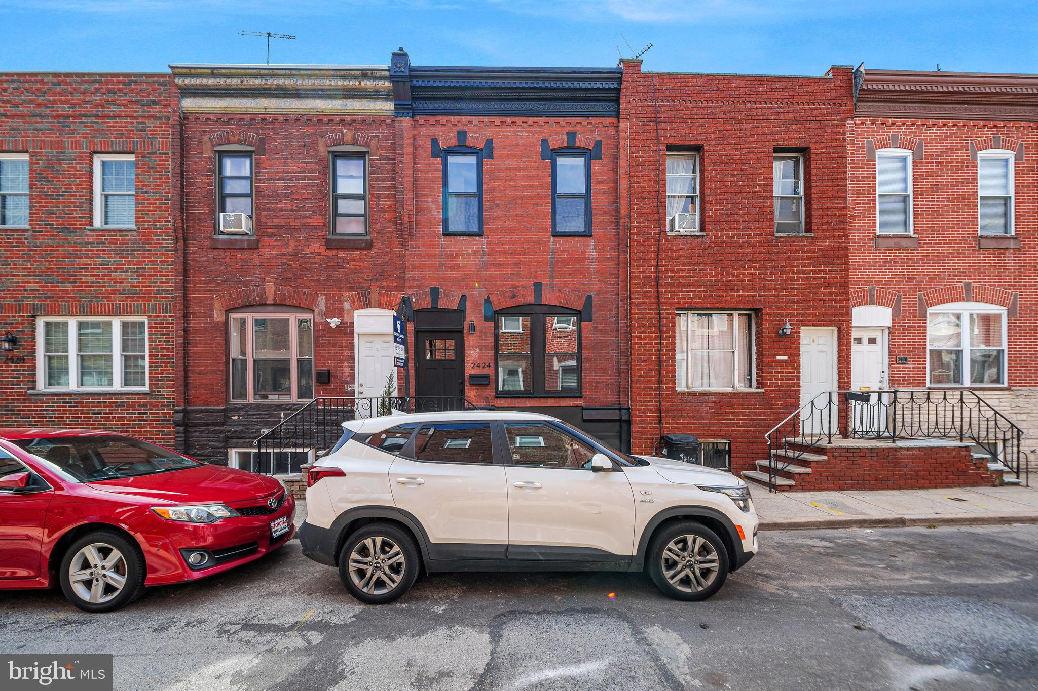 approved renovation 10 year tax abatement. Welcome to this beautifully and thoughtfully renovated 2-bedroom, 2.5-bathroom home located on one of the most desirable streets in Lower Moyamensing. From the moment you step inside, you'll notice the attention to detail and quality craftsmanship throughout. The open-concept living and dining area features an exposed brick accent wall and a striking open staircase that adds character and charm. The kitchen is a true highlight, offering white upper and lower wood cabinetry, stainless steel appliances including a gas stove, microwave, dishwasher, and a double-door refrigerator. A rear door leads to a private backyard—perfect for entertaining, grilling, or simply relaxing outdoors. The partially finished basement provides additional living space, ideal for a home office, gym, or playroom, along with a separate room for mechanicals. Upstairs, the second floor features a spacious primary bedroom with an en-suite bathroom, a second bedroom, and a well-appointed hall bathroom. This home is ideally situated with a Walk Score® of 90, making it a walker’s paradise. It also boasts excellent transit access (Transit Score® 79) and is very bikeable (Bike Score® 86). Enjoy close proximity to public transportation, the Broad Street Line, FDR Park, the Stadium District, and a variety of local shops, restaurants, and neighborhood favorites. With easy access to highways and bridges, this home offers both comfort and convenience in one of South Philly’s most vibrant communities.