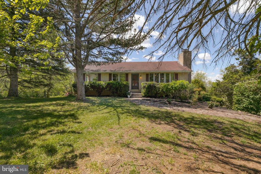 Raised ranch on a total of 3.08 acres over 3 separate deeded lots. All 3 parcels convey.  Home is being sold in AS-IS condition and has great bones.  Hardwood flooring throughout the main living level, a large eat-in kitchen with adjoining screened in porch and deck gives sweeping views of the property and beyond. Home sits on the middle of the three lots. Many ornamental trees and shrubs planted throughout the property. Rear entry oversized two-car garage. Perfect property for a farmette. Brand new well pressure tank, softener.  Buyer could possibly perc test and sell of adjacent lots to be built or keep them together.