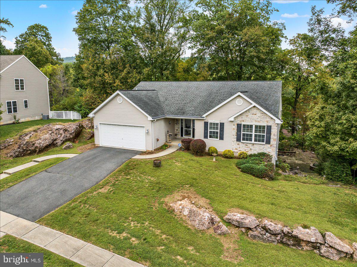 Welcome to 9 Courtney Rea Circle in Exeter Township! If you have been searching for one-floor living, this is an excellent opportunity. This Crestwood ranch home offers approximately 2,200 square feet of living space with three bedrooms (master suite), two full/two half baths, and a two-car garage. You enter the home to the family room with a vaulted ceiling and a gas fireplace. This area transitions nicely to the dining area and kitchen. The kitchen features an island, matching appliances, and a tile backsplash. The dining area provides access to a covered deck. This private outdoor area can be enjoyed throughout the majority of the year. The master suite has a large walk-in closet and a private bath with a double vanity and tile shower. For your convenience, the laundry room is located right outside the master suite. The lower level of the home is partially finished and has a half bath. The walkout basement leads to a paver patio and fire pit on the side of the home. There is also a large portion of the basement that is unfinished. This area is perfect for storage with plenty of space left for a workshop or home gym. Lastly, this is a tough location to beat. Within minutes, you can be at many of the local shopping centers and restaurants. Schedule your showing today!