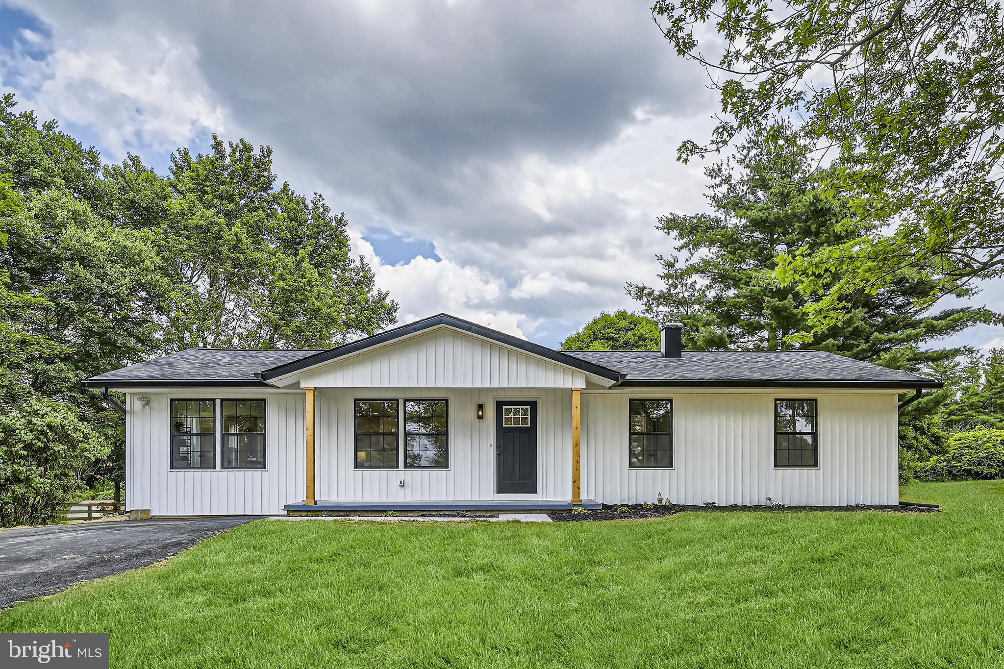 Welcome home to 547 Oak Tree Road! This newly renovated 4 bedroom, 3 full bath rancher is move-in ready with finishes and upgrades right out of a home décor magazine. Enjoy one level living complimented with an open concept floor plan, an abundance of natural light, gorgeous LVP flooring, a spacious living and kitchen combo with sleek quartz countertops and an oversized kitchen island for additional seating. Just off the kitchen awaits a large dining area with access to the fourth bedroom that can double as a home office, playroom, craft room, or game room- the possibilities are endless! Head down the hall to find the primary suite offering 12’ cathedral ceilings, double closets, and a private ensuite featuring tile flooring and an oversized walk-in shower. Two additional spacious bedrooms and cozy second full bath with a soaking tub completes the main level. The finished lower level offers additional living space, a third full bathroom, storage, laundry, and backyard access. Enjoy hosting guests or sipping your morning coffee from the sizable concrete patio just off the dining room. Nestled on a spacious one-acre lot that backs up to trees to give you a private feel while also being part of a neighborhood. But wait there's more! Additional features include white vertical siding complimented with black exterior windows, a covered porch with solid wood beams, a brand new septic system, a freshly coated driveway, recessed lighting throughout, modern wainscotting, tasteful light fixtures and much, much more. Conveniently located a stone’s throw away from Westminster and Sykesville for convenient shopping, dining, and commuting. You won’t want to miss this one!