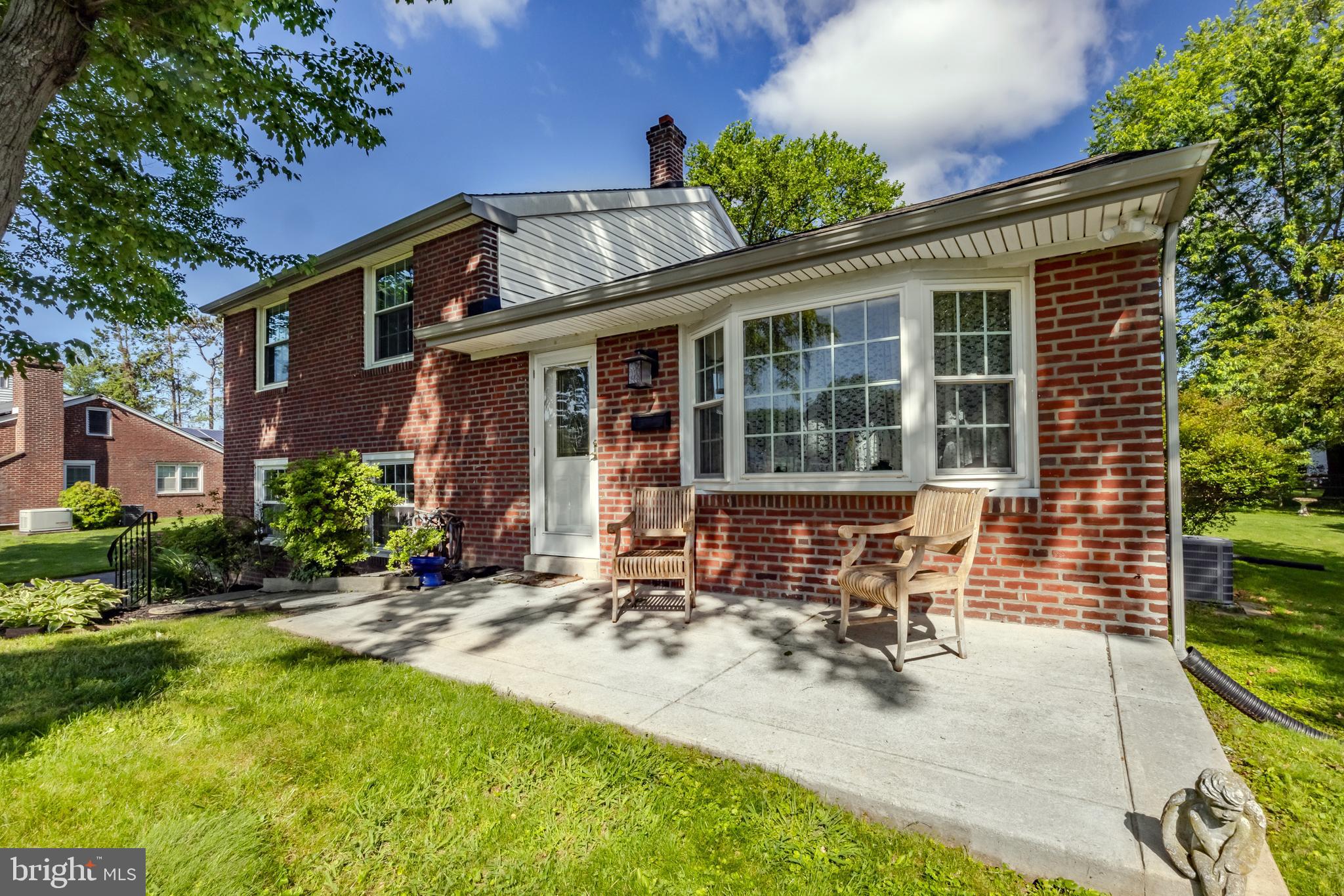 Location, charm and love! Welcome to 105 Lombardy Dr in the heart of the coveted Sproul Estates neighborhood of Wallingford. This 3 bedroom 1.5 bath split level home offers large living spaces, a nice level lot, front porch, back deck, a brand new HVAC system and a renovated kitchen. Pull up and immediately admire the classic brick front curb appeal. The first floor of the home has a large and sunlit living room with its bay window and oak hardwood floors. The kitchen and dining room have been converted into one large space to include tons of cabinetry, a large peninsula, granite countertops, a large dining space and access to the back deck- perfect for hosting 3 seasons a year. The 2nd floor offers 3 bedrooms and a hall bath. The attic space has been used as a 4th bedroom in years past and can also offer phenomenal storage space! The lower level has great rec room space, a half bath and a separate laundry room as well as utilities. The backyard is level, the driveway is large and this property is ready for its new owner. Sproul Estates is known for its tree lined streets, offering easy access to schools and parks yet is perfectly tucked away. Take advantage of the award winning school district and this very loved and ready to go home!