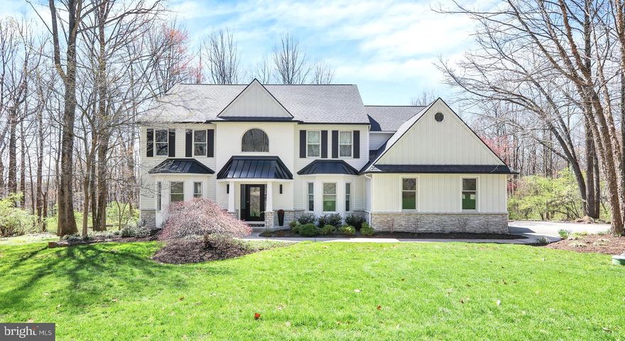 Skip the wait of new construction and enjoy the benefits of a fully updated home-where thoughtful design, and timeless elegance are already in place! Welcome to this exquisite luxury estate nestled on just under 3 private wooded acres in the Owen J. Roberts School District. This breathtaking two-story home offers an exceptional blend of  comfort, and modern upgrades throughout. Boasting 4 bedrooms, 4.5 baths, and a fully finished lower level, this home is designed to impress. Highlights include dual staircases, beautiful flooring that includes hardwood, a stunning remodeled gourmet kitchen with new appliances, updated bath, gas fireplace, automatic blinds and a completely refreshed exterior. The expansive main level features a dramatic two-story foyer, private home office with French doors, formal living room, and an elegant dining room accented with chair rail. The show-stopping chef’s kitchen is a true centerpiece, offering a large seated island, high-end cabinetry, pantry, breakfast nook, and top-of-the-line appliances including a Sub-Zero refrigerator, double oven including a Miele moisture oven and premium built-ins. Just off the kitchen, the impressive family room features a floor-to-ceiling fireplace and vaulted ceiling, creating a warm yet sophisticated gathering space. A convenient half bath and laundry room complete the main level. Upstairs, accessible by two staircases, you’ll find four generously sized bedrooms and three full baths, along with open-to-below views that enhance the home’s airy feel. The luxurious primary suite offers a spacious retreat with a spa-like bath featuring a soaking tub, walk-in shower, and large walk-in closet. One additional bedroom includes a private en-suite bath, while the remaining bedrooms share a well-appointed hall bath. The finished lower level expands the living space with a large rec room featuring a private entrance, full bath, bonus room, and a versatile space ideal for a gym, playroom, or media area. Ample storage is also available. Outdoor living is equally impressive with a large rear deck, partially covered by an awning and complemented by a screened-in section—perfect for relaxing or entertaining in any weather. The wooded lot provides privacy while still offering a generous open yard area. This exceptional property truly must be seen to be appreciated. Schedule your private tour today.