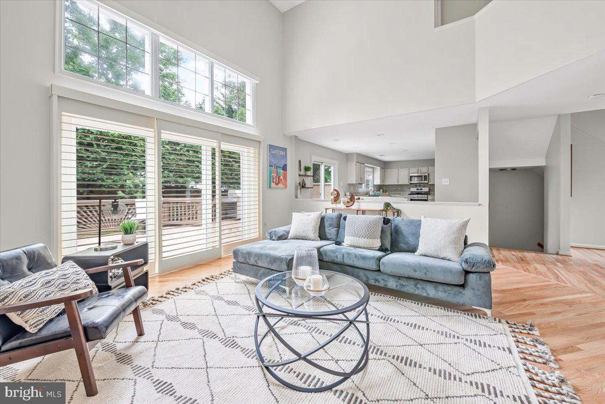 This is the one. You've been eying that new build down the street, but this one is better. The 90's knew how to build them. With over 4,000 sqft of finished space, this home boasts three levels of light-filled oversized high-ceiling rooms filled with everything you didn't know you wanted/needed in a home.
The main level is perfect for you if you're an entertainer or you're just trying to survive the week. The vaulted two-story family room and open eat-in kitchen that allows you to hang with your guests as you prepare Thanksgiving dinner or watch the little ones as you cook mac'n cheese. The formal dining room gives you a space always ready for school projects or dinner for ten. If formal is your thing, the front living room is always ready to host those guests you don't want getting too far into the house. If you're a work-from-home or a one-level living kinda person, the massive bedroom/office with walk-in closet and attached bath will be your new favorite spot. If outside is more your style, the back deck is perfect for bbq's, bird watching, and even includes a space for a byoht (bring your own hot tub).
The upper level opens to below, giving the entire home an open, this-is-my-castle kind of feeling. The west wing is the primary suite, the gem of the house for those needing their own space. This is where you lock the doors on a Saturday morning and relax, or kick back on a Sunday afternoon and enjoy soaking in the tub with tea and a book. For those forced to share their space with the one they love, there are dual separated sinks (other side of the room separated), a shower built for two, and a toilet in its own door.
With three additional bedrooms, the upper east wing keeps the kids/guests close, but not too close. They have their own bathroom with doors separating the naked/non-naked areas and dual sinks so that even the most territorial siblings can share. There's even a washer and dryer right where they should be by the bedrooms, and the dirtiest clothes.
If that's not enough, there is even more on the lower level. For extended stay guests, you'll love the light-filled bedroom and extra full bath. For those who need a space to let the energy out, the rec room is perfect for morning yoga, afternoon climbs on the rock wall, and evening antics on the ninja course. For those more practical folks, you'll appreciate the attached two-car garage for your cars and bikes, and hobbies and the entry/mudroom space that keeps the backpack, jacket, and shoe chaos from the front door so you won't have to make the mad dash, hide it before they see it, scramble when guests are coming over.
This perfect home is conveniently located steps from Homewood Park and the bilingual Oakland Terrace Elementary. It's minutes to the coffee at La Gelatteria or a drink at BabyCat Brewery. If you're more concerned about the everyday staples, you'll be excited to be close to Safeway, Costco, Target, and the Westfield Mall. For commuters, the Redline is only a scooter ride away, and the Beltway is just down the road.
