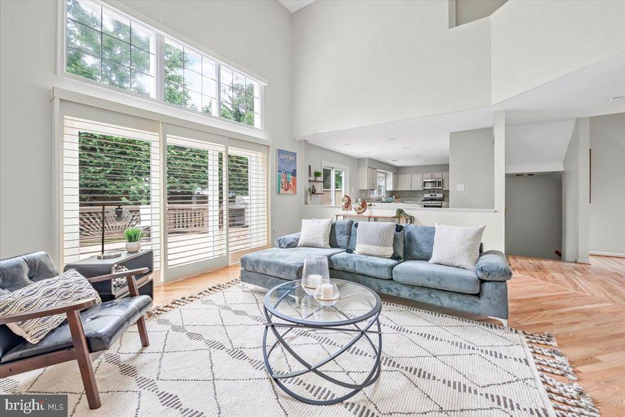 This is the one.  You've been eying that new build down the street, but this one is better.  The 90's knew how to build them.  With over 4,000 sqft of finished space, this home boasts three levels of light-filled oversized high-ceiling rooms filled with everything you didn't know you wanted/needed in a home.

The main level is perfect for you if you're an entertainer or you're just trying to survive the week.  The vaulted two-story family room and open eat-in kitchen that allows you to hang with your guests as you prepare Thanksgiving dinner or watch the little ones as you cook mac'n cheese.  The formal dining room gives you a space always ready for school projects or dinner for ten.  If formal is your thing, the front living room is always ready to host those guests you don't want getting too far into the house.  If you're a work-from-home or a one-level living kinda person, the massive bedroom/office with walk-in closet and attached bath will be your new favorite spot.  If outside is more your style, the back deck is perfect for bbq's, bird watching, and even includes a space for a byoht (bring your own hot tub).

The upper level opens to below, giving the entire home an open, this-is-my-castle kind of feeling.  The west wing is the primary suite, the gem of the house for those needing their own space.  This is where you lock the doors on a Saturday morning and relax, or kick back on a Sunday afternoon and enjoy soaking in the tub with tea and a book.  For those forced to share their space with the one they love, there are dual separated sinks (other side of the room separated), a shower built for two, and a toilet in its own door.

With three additional bedrooms, the upper east wing keeps the kids/guests close, but not too close.  They have their own bathroom with doors separating the naked/non-naked areas and dual sinks so that even the most territorial siblings can share.  There's even a washer and dryer right where they should be by the bedrooms, and the dirtiest clothes.

If that's not enough, there is even more on the lower level.  For extended stay guests, you'll love the light-filled bedroom and extra full bath.  For those who need a space to let the energy out, the rec room is perfect for morning yoga, afternoon climbs on the rock wall, and evening antics on the ninja course.  For those more practical folks, you'll appreciate the attached two-car garage for your cars and bikes, and hobbies and the entry/mudroom space that keeps the backpack, jacket, and shoe chaos from the front door so you won't have to make the mad dash, hide it before they see it, scramble when guests are coming over.

This perfect home is conveniently located steps from Homewood Park and the bilingual Oakland Terrace Elementary.  It's minutes to the coffee at La Gelatteria or a drink at BabyCat Brewery.  If you're more concerned about the everyday staples, you'll be excited to be close to Safeway, Costco, Target, and the Westfield Mall.  For commuters, the Redline is only a scooter ride away, and the Beltway is just down the road.