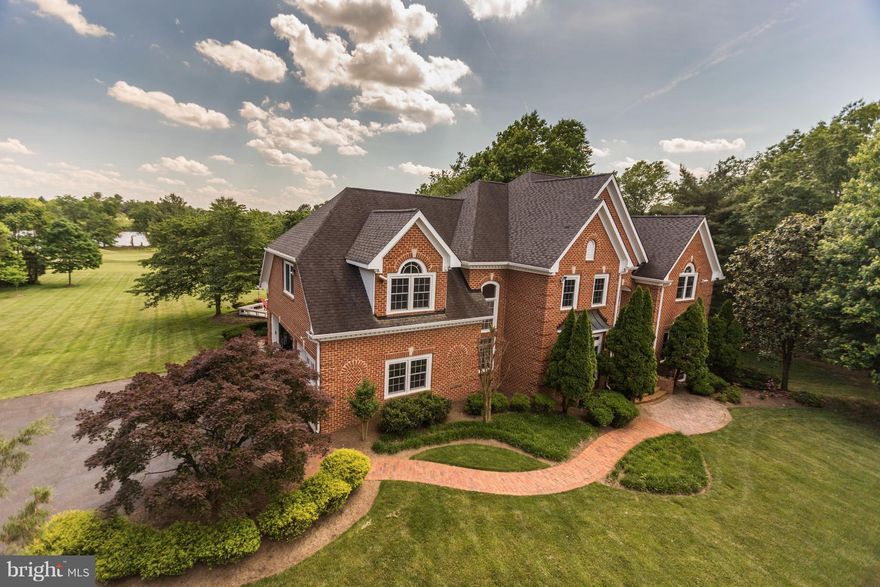 4 sided brick colonial Estate backing to Chantilly National Country Clubs 10th hole w/ beautiful lake view & 3 car side load garage on 5+ acres lot. Main level is open & perfect for entertaining. Master suite has a brand new master bath, dual walk-in closets & porch w/ gorgeous views.The LL has a bar, poker area, rec room, exercise room & full bath. *WESTFIELD HS pyramid* VolleyBall court in back.