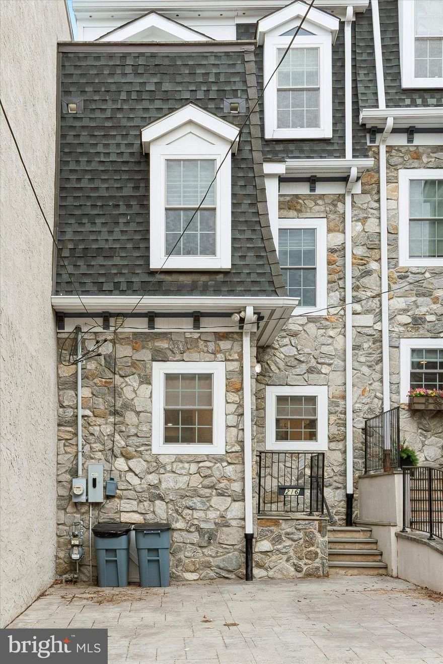 Welcome to this stunning 3-bedroom, 2.5-bath home offering three finished levels of modern living with high-end finishes throughout. The striking stone front and two off-street parking spaces provide great curb appeal and convenience.
This newer construction home features a bright, open-concept layout with recessed lighting, custom trim, and stylish finishes. The main level features a spacious living area with tray ceiling, flowing into the dining space and out to sliding glass doors leading to a private rear patio—perfect for indoor-outdoor living.
The kitchen is the heart of the home, ideal for everyday living and entertaining. This stunning, thoughtfully designed kitchen perfectly blends modern elegance with everyday functionality. Featuring crisp white, ceiling-height shaker cabinetry paired with sleek black hardware, the space offers a timeless yet contemporary feel.
The show-stopping centerpiece is a spacious island with a striking two-tone design—topped with beautiful white quartz countertops accented by subtle gray veining and a bold contrasting base. Perfect for entertaining, the island provides ample seating for casual dining or gathering with guests.
The kitchen is equipped with stainless steel appliances, including a French door refrigerator and a professional-style gas range with a modern vent hood. A clean, understated backsplash enhances the cohesive and polished aesthetic.
Designer lighting elevates the space, highlighted by a geometric pendant fixture over the island and complemented by recessed lighting throughout. Light, natural-toned flooring adds warmth while maintaining the bright and airy feel.
Additional features include a deep undermount sink positioned beneath a window for natural light, a convenient​ ​foyer area with tile flooring, and seamless access to the home’s living spaces.
The fenced-in patio offers a cozy, low-maintenance outdoor space perfect for dining or relaxing.
Upstairs, generously sized bedrooms offer plenty of natural light. The primary suite includes a sitting area, Juliette balcony, private deck with city views,​ ​2 walk-in closet​s with custom built-ins, and a spa-like en-suite bath with dual vanity, glass shower, and soaking tub.
Additional bedrooms provide flexibility for guests, a nursery, or a home office, along with a full hall bath featuring a double vanity and tiled shower/tub.
Additional features include a laundry room with a utility sink,  DUAL energy-efficient HVAC systems, and much more.
Located in a highly desirable area of Manayunk, Close to transportation, both bus and train.  Quick commute to center city and the suburbs. Conveniently located near Fairmount Park and Main Street Manayunk.