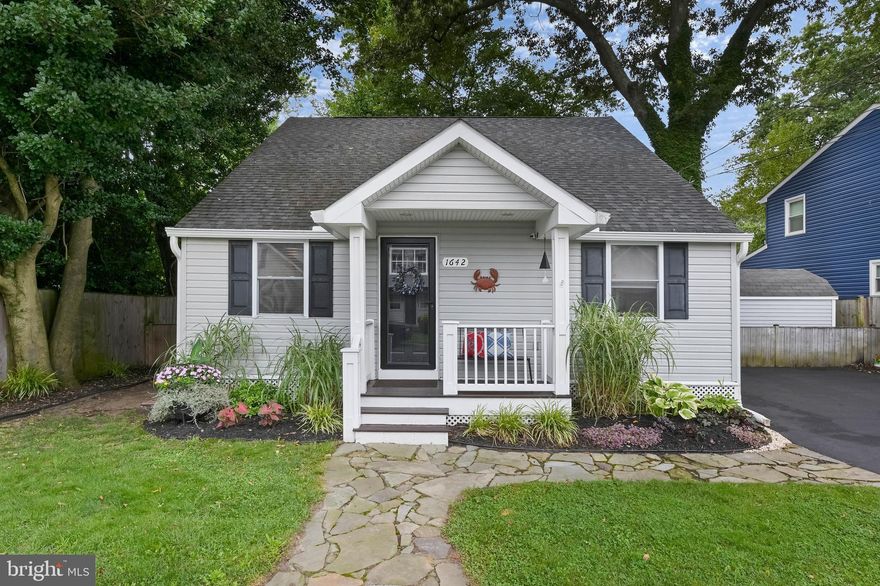 Offer deadline 4pm on Sunday, August 20.      Nestled in the vibrant amenity rich water-privileged community of Woodland Beach, this quaint 3-bedroom, 2-bath home is a true gem!   As you approach the home, you'll be greeted by a charming porch, tasteful landscaping and curb appeal that instantly sets the tone for the warm atmosphere inside.  As you enter through the front door  you'll appreciate the seamless flow and functional layout.  The combination of wood floors and the abundance of natural light in the living room creates an inviting feeling, making it an ideal space for quality family time and relaxation. The kitchen's open concept seamlessly connects it to the dining area, allowing for ease of conversation while preparing meals. Whether it's an intimate dinner for two or a lively celebration with friends, this kitchen is the heart of the home.  Step out the kitchen door and you'll find yourself on  back deck, the perfect extension of your entertainment space. This space offers room for outdoor furniture, making it an ideal spot for hosting barbecues, al fresco dining, or simply relaxing with a good book and a refreshing drink.  The fenced in yard is perfect for your 4 legged friends!  The first level is home to the washer/dryer as well as the primary bedroom with en suite bath.  The upstairs area features two bedrooms and a full bath.  A valuable addition to the second floor is the storage area, providing the perfect solution for organizing your belongings and housing seasonal decorations.   Community amenities include 5 miles of shoreline, netted swimming area, multiple sandy beaches, tot lots, community center, dock and slips.  Conveniently located to major highways allows for ease of  commute to DC, Baltimore and Annapolis.  Just minutes to multiple grocery stores, schools,  library, doctors offices and restaurants.  Special tax district - $240/year.  Upgrades to include: 2018:
Paved driveway, installed outdoor electric plug  both front and back , re-insulated the crawlspace
2019: Rebuilt the stairs,  installed hardwired under counter lights in kitchen,  put in hardwood on stairs and upstairs. 2020: New gutters with built in metal gutter guard, stone patio and fire pit, split cable from family into primary bedroom, updated landscaping.  2021: New heat pump, installation of new stone, backsplash in kitchen. 2022:  Installed larger pantry, redid master bathroom with new fixtures, new high powered garbage disposal in kitchen , uv system in kitchen.  2023:  New front and back doors with digital lock.