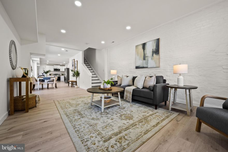 Welcome to 1118 S Carey Street — a truly one-of-a-kind, oversized home in the heart of Pigtown. Formerly a commercial property, this unique residence offers an expansive layout rarely found in the area, now fully transformed with a top-to-bottom renovation.

Everything is brand new, including plumbing, HVAC, electrical, and all appliances — offering peace of mind and modern efficiency. The main level features a bright, open-concept living and kitchen area perfect for entertaining, along with a convenient laundry room and half bath at the rear of the home.

Upstairs, the spacious owner’s suite is a showstopper, wrapped in seven oversized windows that flood the space with natural light, complemented by stunning exposed brick. Two additional generously sized bedrooms and a full hall bath complete the second level.

The fully finished basement adds even more versatile living space, ideal for a den, media room, or guest area, and includes a full bathroom and dedicated storage room.

With its rare size, thoughtful renovation, and prime location near downtown, stadiums, and major commuter routes, this home is a standout opportunity in one of Baltimore’s most vibrant neighborhoods.