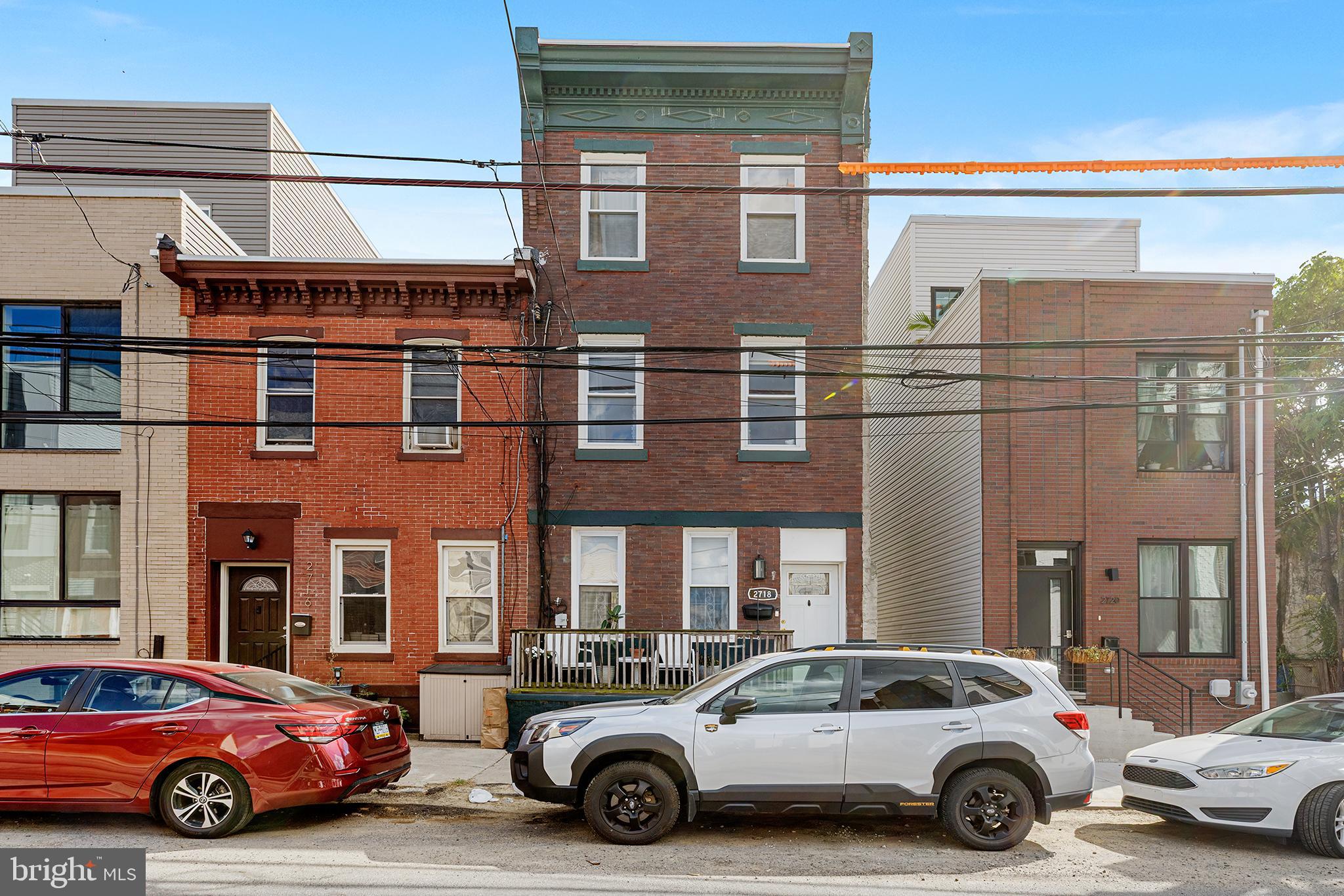 Set along a classic Philadelphia block in the heart of Brewerytown, this stately four-bedroom residence blends timeless character with thoughtful updates. Behind its handsome traditional brick façade, accented by an original wooden cornice, a welcoming front porch sets the stage for a home that feels both historic and alive with possibility. Inside, the scale impresses immediately; expansive ceilings, tall windows, and original hardwood floors create a sense of openness and light throughout the home. The generous layout offers four true bedrooms, a rare find in the neighborhood, providing abundant space for family, guests, or a home office.
At the heart of the home lies an updated, stylish kitchen, perfectly balancing modern function with warm design, while a gorgeous tiled mantle adds a touch of artistry and classic Philadelphia charm. With two full bathrooms, central air, and thoughtful details throughout, the home combines everyday comfort with a graceful sense of style. Step outside and you’re perfectly positioned to enjoy Brewerytown’s best—walk to RyBrew, Spot Burger, Baby’s Kusina, and even Aldi for everyday convenience. Need to venture further? Just hop on the Route 15 trolley and you’re seamlessly connected to the rest of the city. This is a home where past and present harmonize. Historic craftsmanship, modern updates, and a layout that feels both impressive and livable that is set within one of Philadelphia’s most dynamic and walkable neighborhoods.