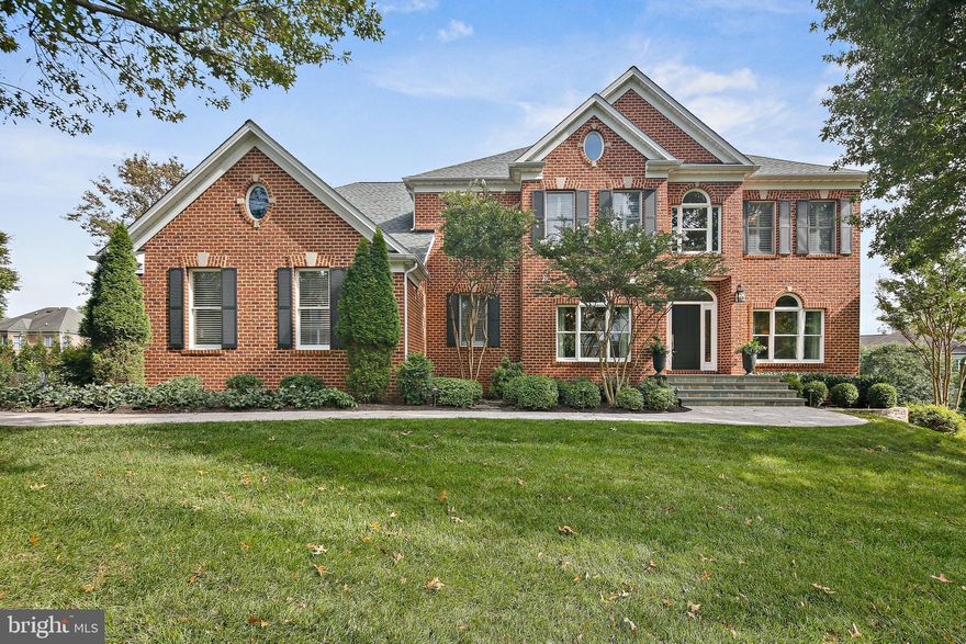 Elegant all brick 6 bedroom, 5 bath transitional home in coveted Turf Valley Vistas offers over 5000+ finished sqft on a manicured cul-de-sac homesite with incredible curb appeal. Enter the dramatic 2 story foyer where you are greeted by warm hardwoods with a center inlay medallion, a radiant living room with crown molding and palladian windows and a formal dining room with tray ceiling to host intimate gatherings and holiday dinners. An impressive two story sunken great room showcases levels of picture windows, a comfortable gas fireplace, a neutral color palette, stately columns and a view of the staircase that leads to the upstairs quarters. The gourmet kitchen boasts white shaker style cabinetry, ceramic floors, a center island with 5 burner gas cooktop and downdraft, stainless steel appliances, quartz and granite countertops, a dry bar, walk in pantry and lots of recess, pendant and chandelier lighting. The adjacent breakfast area for eating in extends into the sunroom for extra space and sprawling out. And a private office just off the kitchen is perfect for working from home. The main level living area also boasts a bedroom perfect for guests in separate quarters from the upstairs, complete with their own full bath. When turning in for the night, head through the double door entryway into the primary suite adorned with tray ceiling, hardwood floors, a sitting room with windows to view the outdoors, two walk in closets and an updated en suite complete with separate shower, jacuzzi tub, and two separate vanities. The additional 3 bedrooms upstairs also have hardwood floors throughout and louvre shutters. All upstairs baths have been renovated. Expansive lower level rec room offers space for whatever you may envision. Plenty of space to watch tv, movies, play games, and exercise.  The spacious 6th bedroom is located here with it's own walk in closet, picture window and a full bath located just outside the bedroom, it is perfect for any additional guests you have staying with you. The backyard outdoor living space is ideal for grilling on the deck, dining al fresco, playing outdoor games and just relaxing on the firepit paver area. Firepit is not included. Roof was replaced in 2020. Home is conveniently located close to commuter routes I70, I695, Rts 32 & 29, shopping centers, parks, golf courses. Districted in sought after Howard County public schools. This one is not to be missed. Schedule your showing soon. Offer deadline is Sunday 11/19/2023 at 6pm. Please, bring your highest and best.